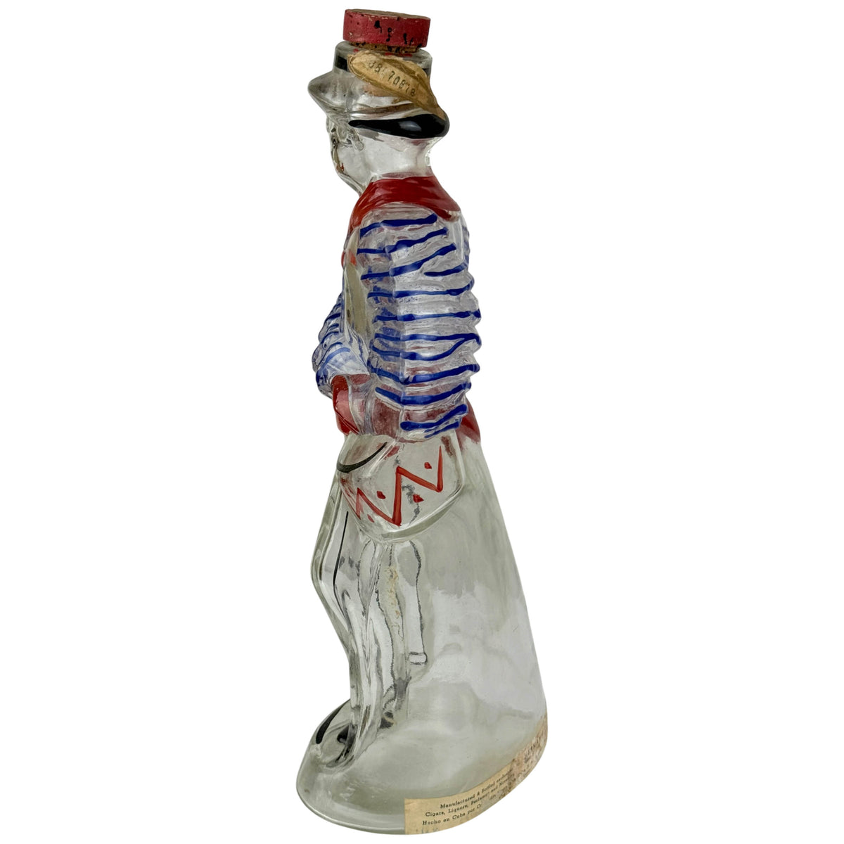 side view of Vintage Cuban Crema Banano Figural Liquor Bottle Rumba Dancer
