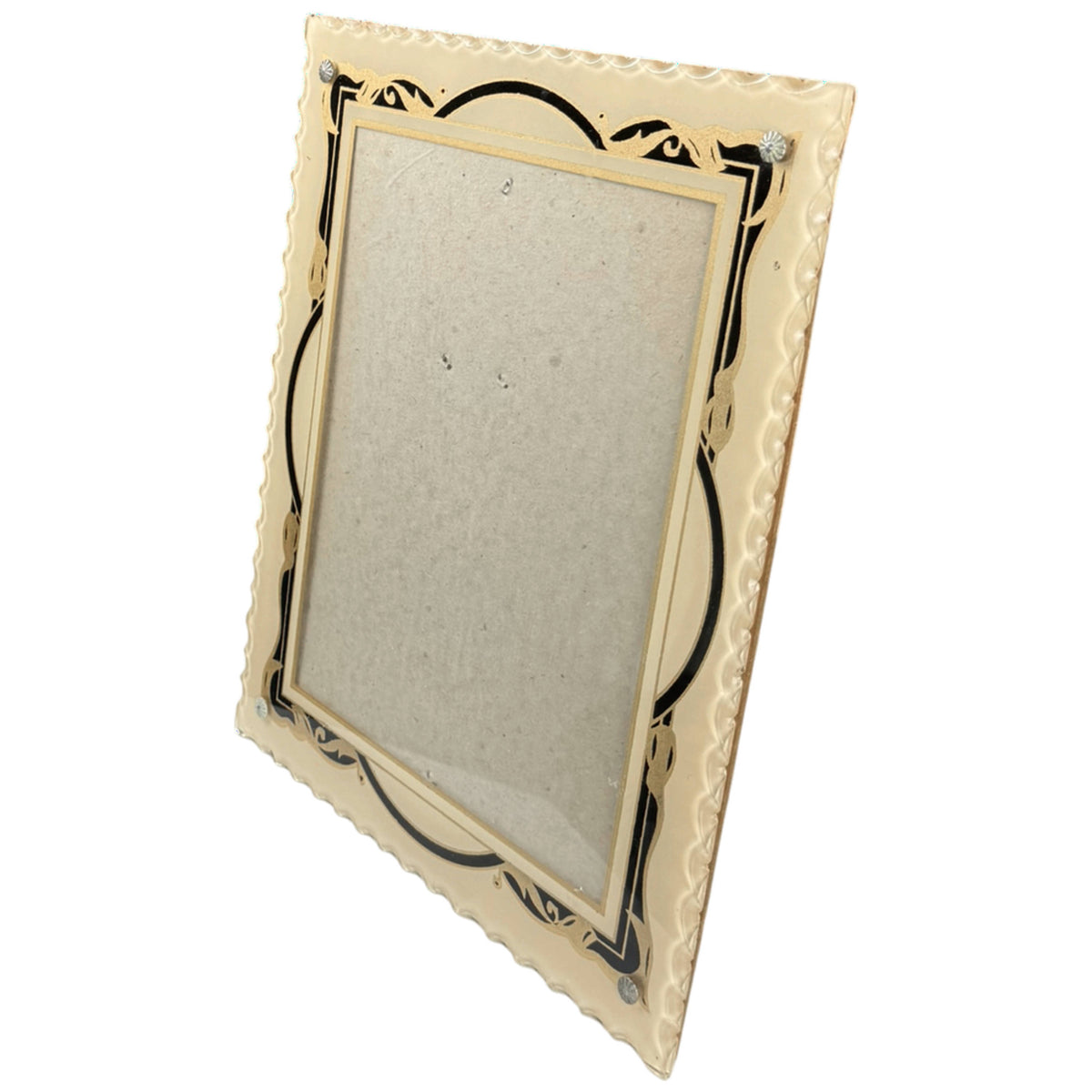 Angled view of Art Deco glass photograph frame showing scalloped glass edges, reverse-painted black and gold decoration and metal rosette screws.
