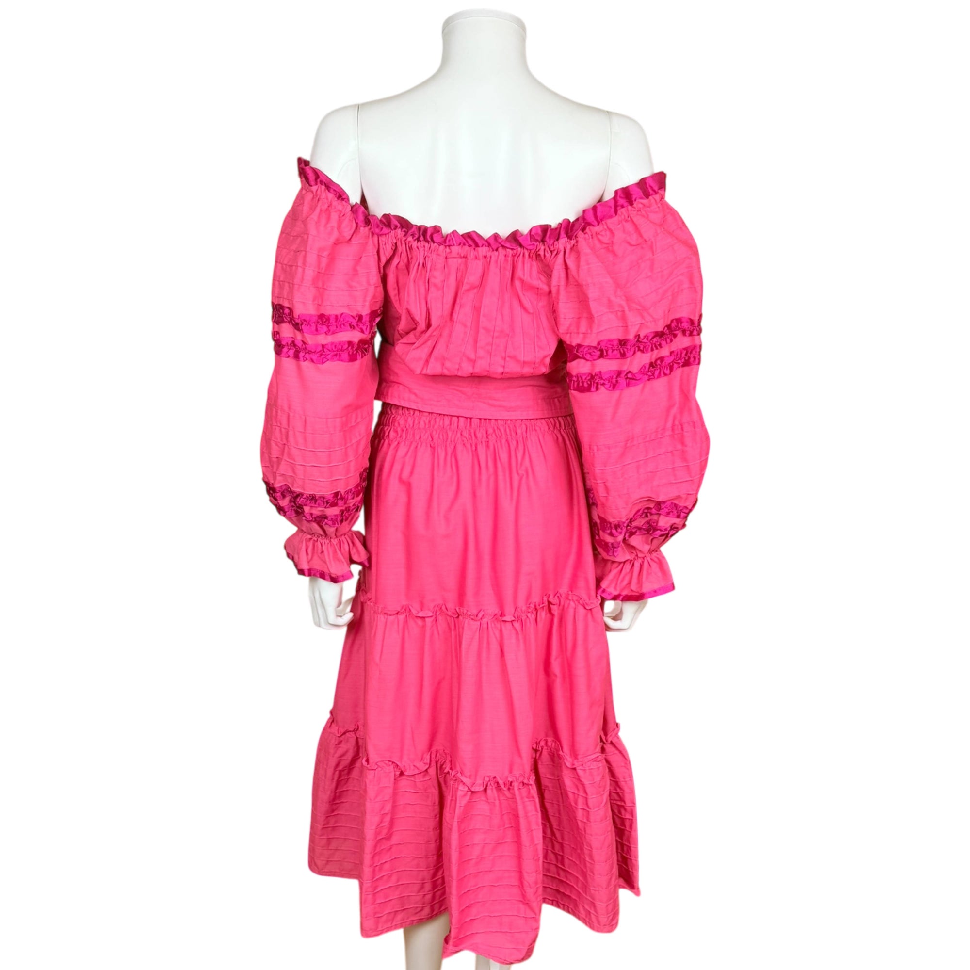 Back view of Georgia Charuhas pink off shoulder dress 