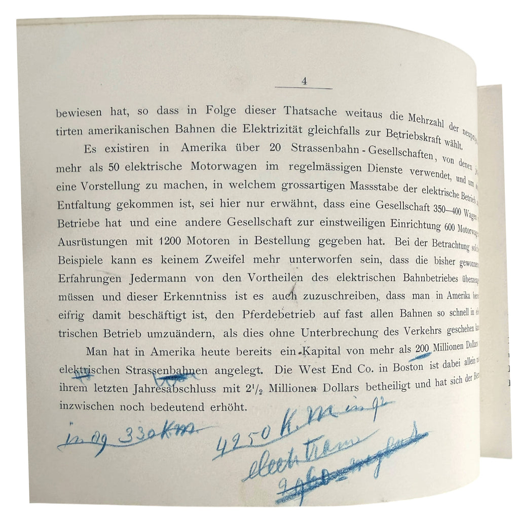 A scanned vintage German book page with printed black text and blue handwritten ink annotations