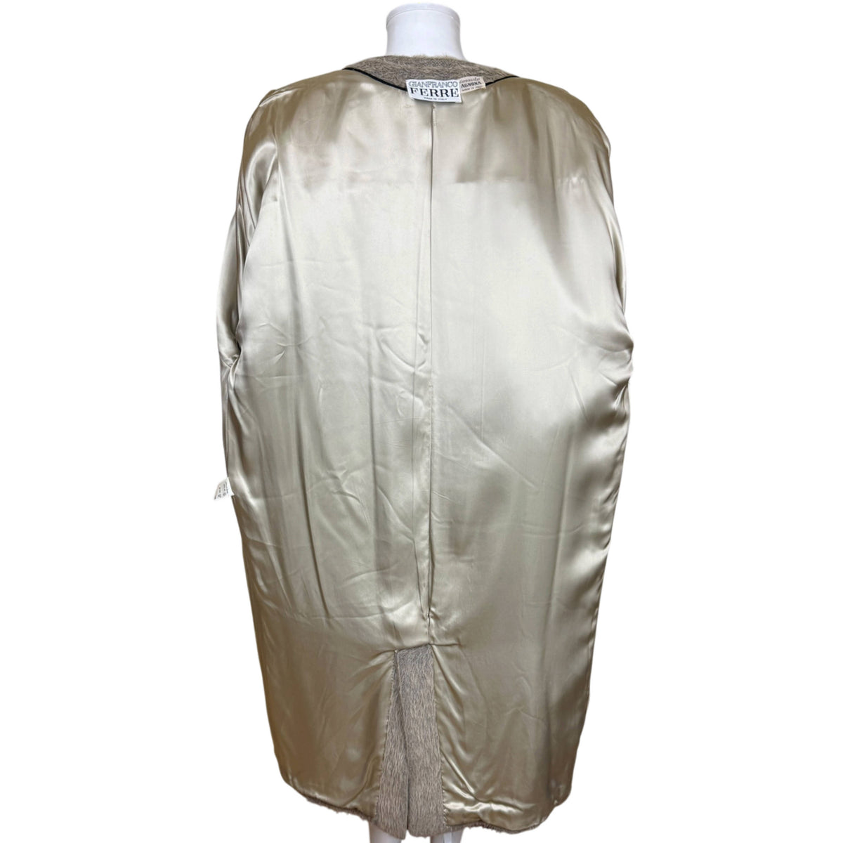 Interior view of Gianfranco Ferré coat showing champagne-beige rayon satin lining and back vent