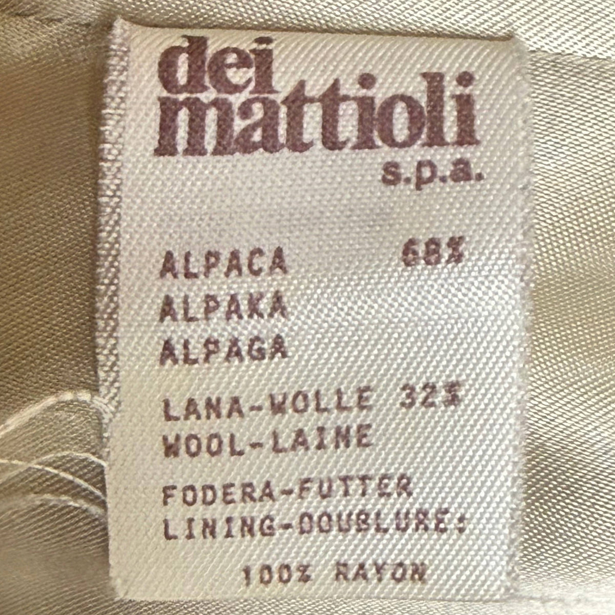 Original Gianfranco Ferré coat composition label showing 68 percent alpaca, 32 percent wool and rayon lining
