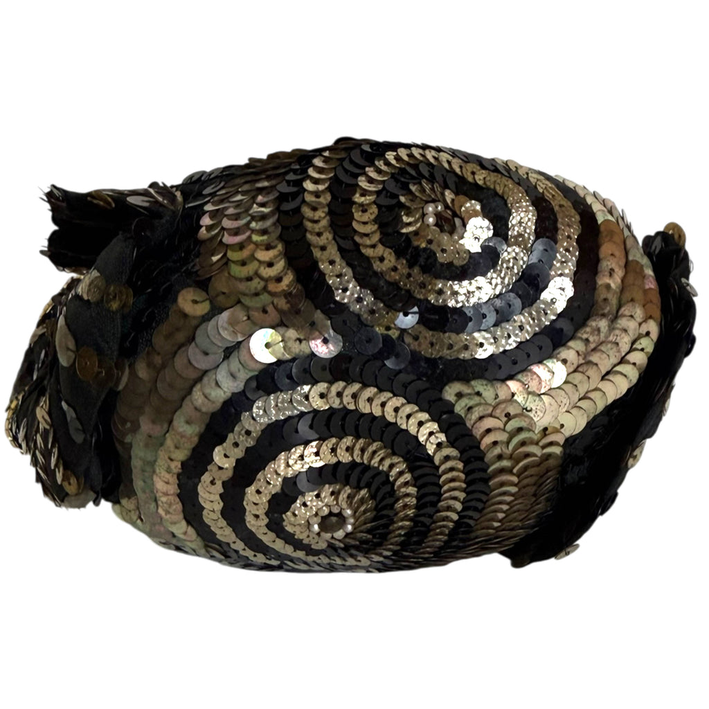 view of bottom with circular gold and black sequin pattern with faux pearl accents