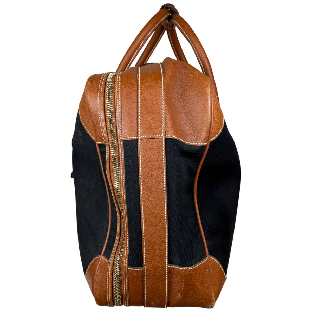 Vintage Gucci travel bag side view with leather trim