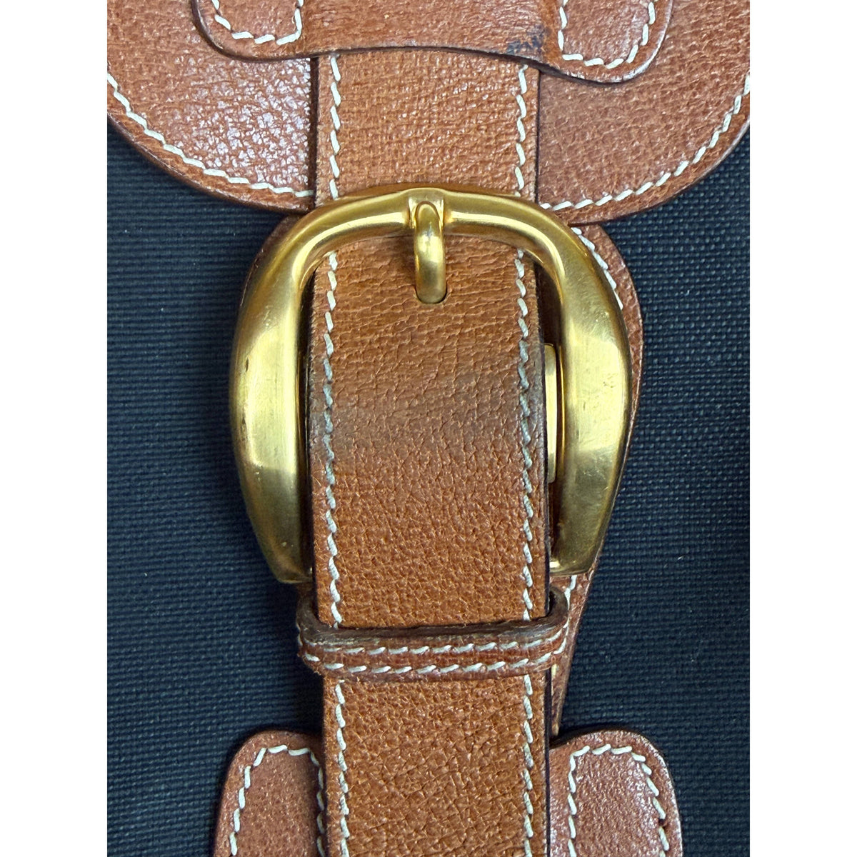 Vintage Gucci suitcase brass buckle and leather strap detail