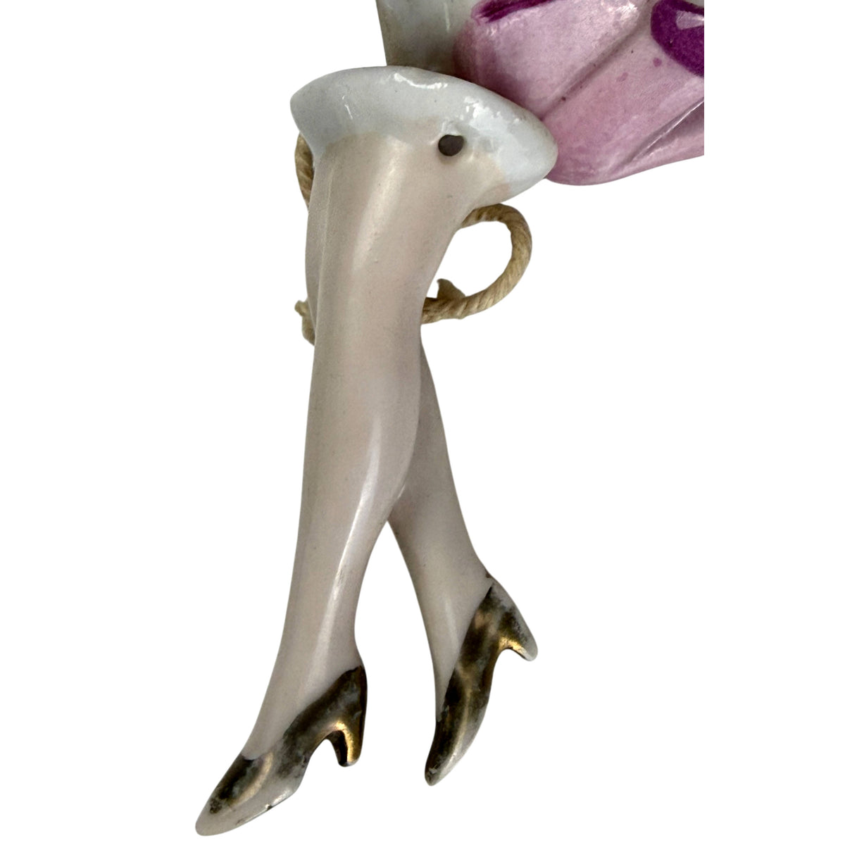 Matching crossed porcelain legs with metallic gold high-heeled shoes from antique German half doll