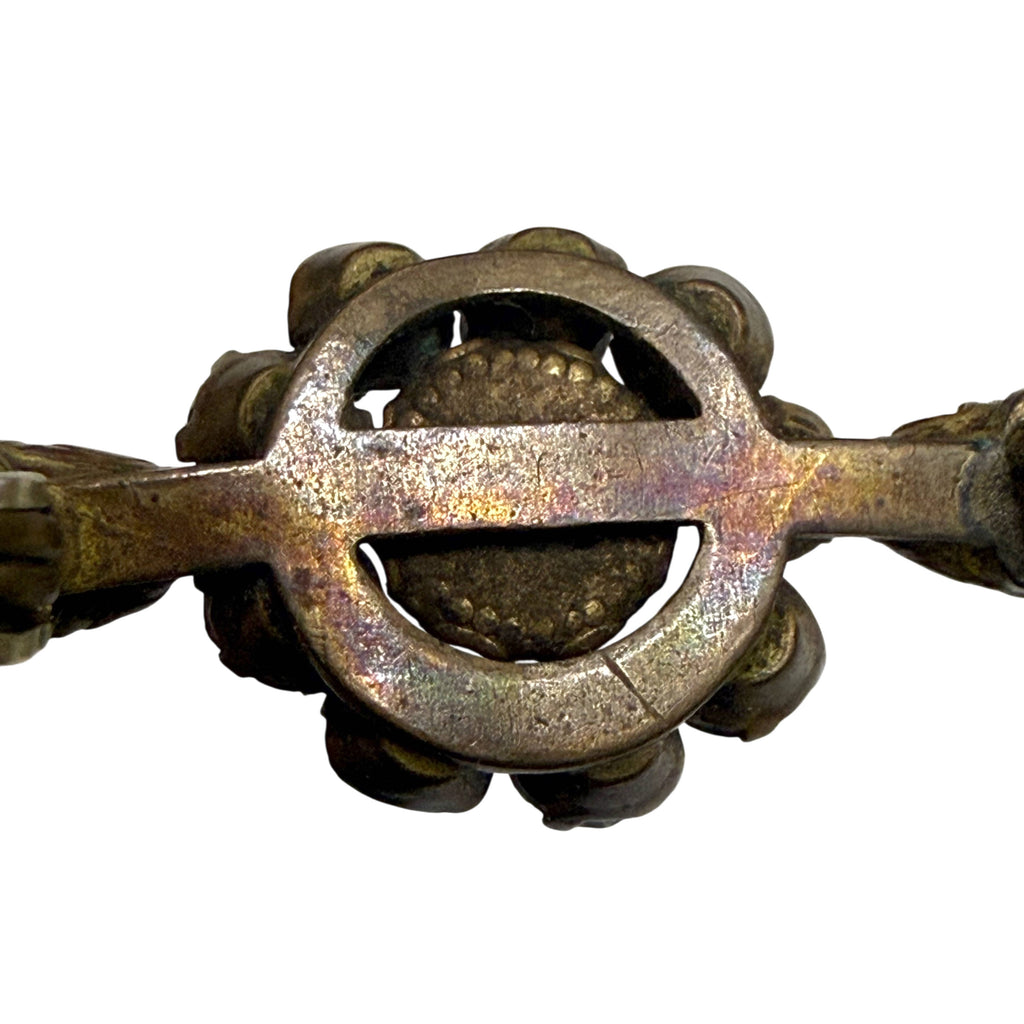 Close-up of aged metal openwork framework on reverse of antique Victorian paste rhinestone brooch