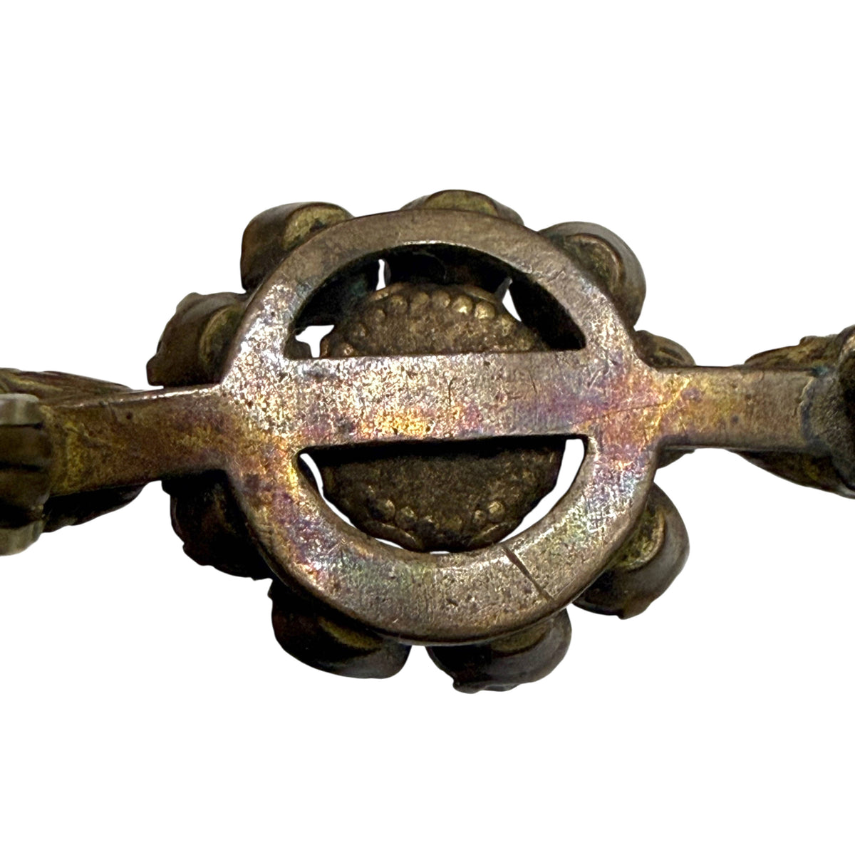 Close-up of aged metal openwork framework on reverse of antique Victorian paste rhinestone brooch