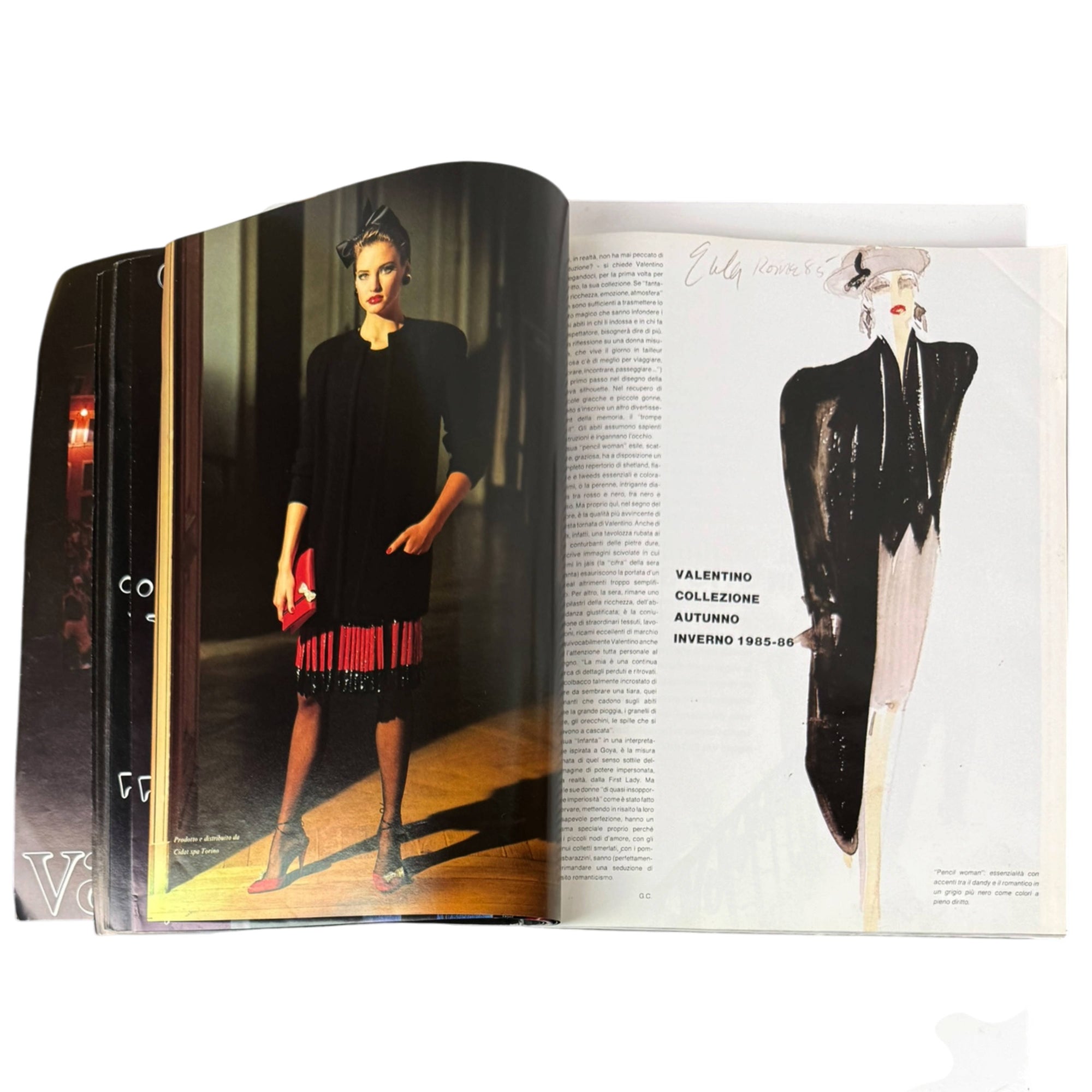 An open vintage harper's bazaar Italia Valentino special magazine spread showing a fashion photograph of a model in a black dress with red fringe on the left page, and a fashion illustration of a woman in a black and white outfit on the right page.