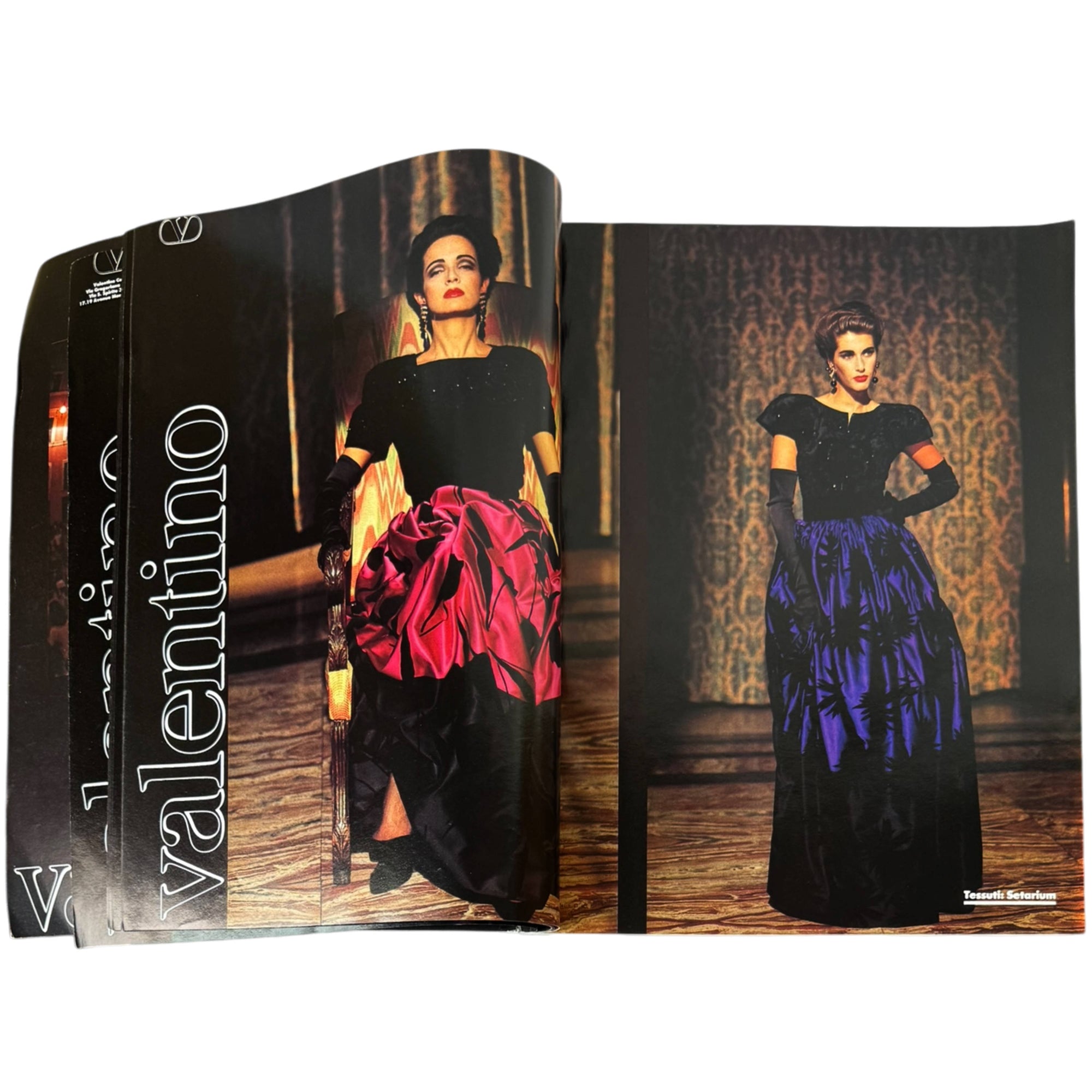 An open vintage Harper's Bazaar Italia magazine spread featuring a model in a Valentino black dress with a large red skirt on the left page and another model in a black dress with a blue skirt on the right page.