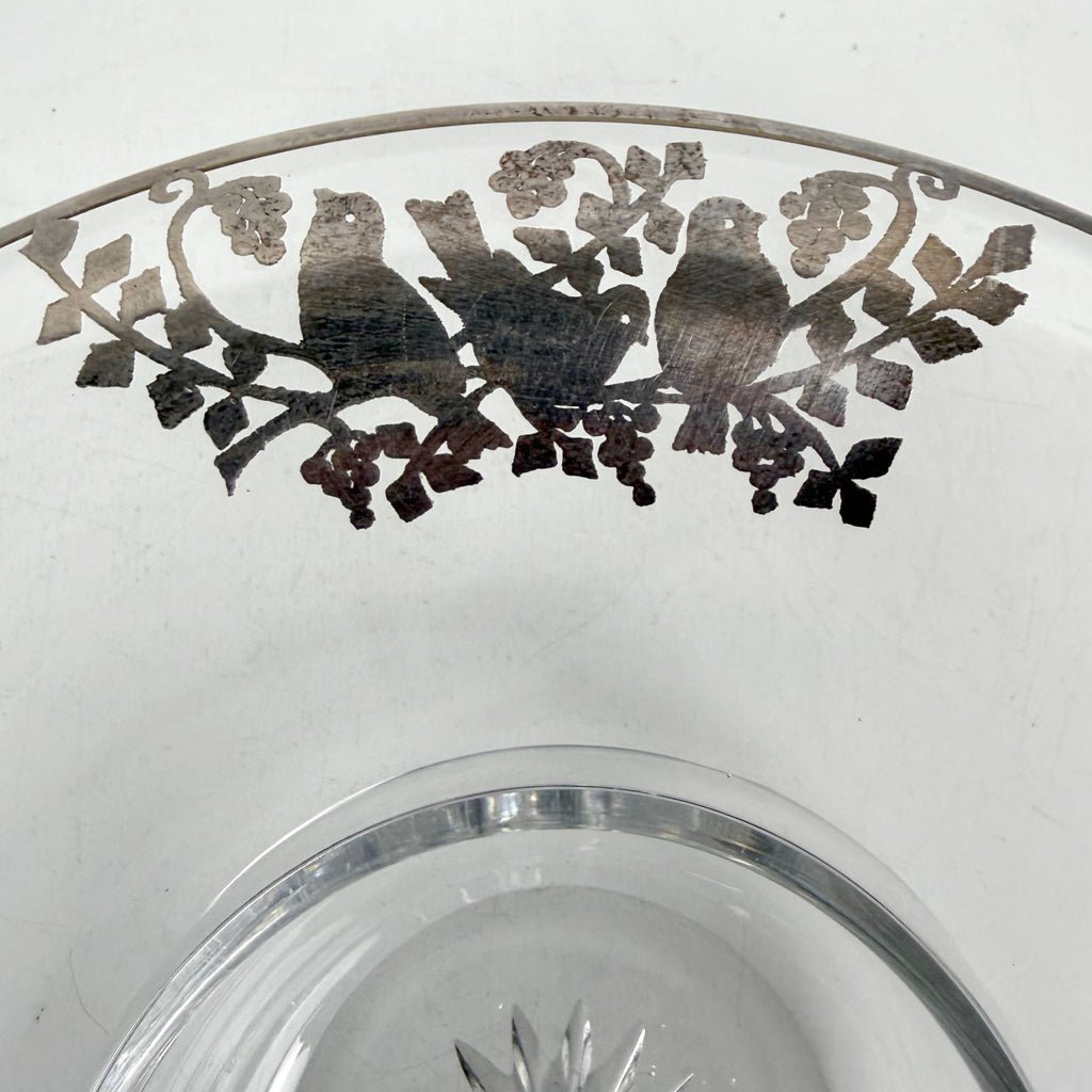 Close-up of silver overlay lovebirds on Heisey glass bowl rim