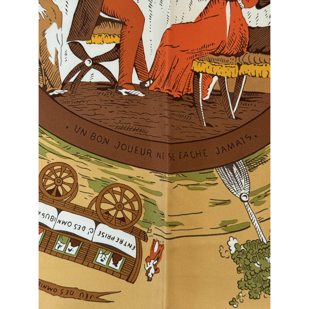 detail of Vintage Hermes Silk Scarf Jeu des Omnibus that reads Un Bon Joueur Ne Se Fache Jamais