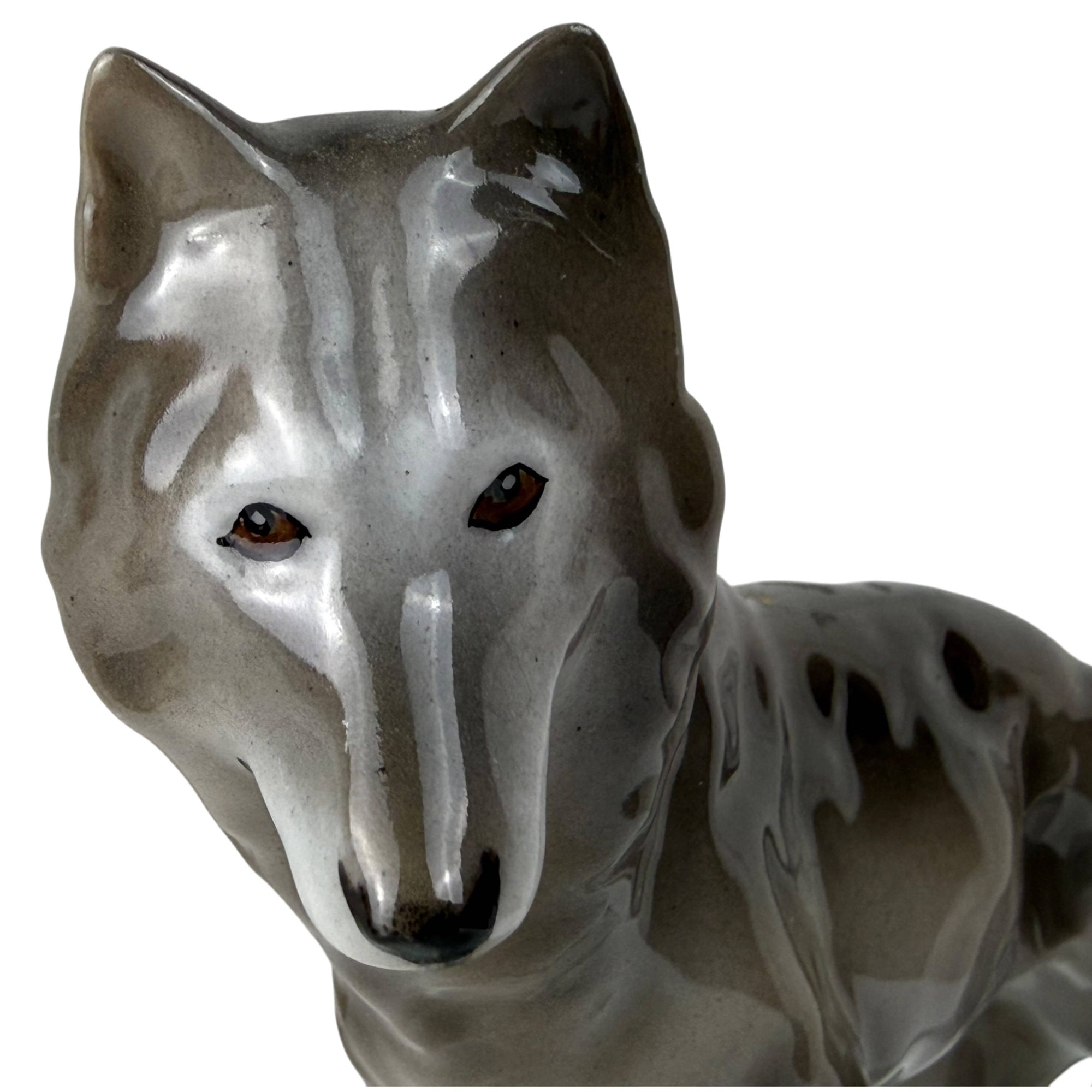 close-up of face of wolf figurine