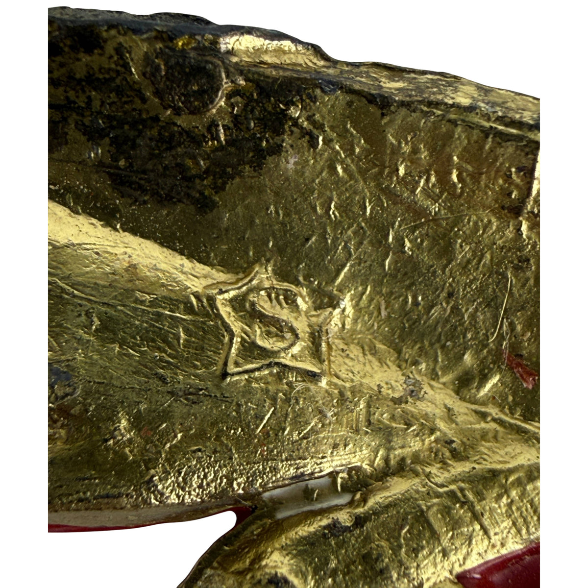 S within five-pointed star mark on vintage bird brooch