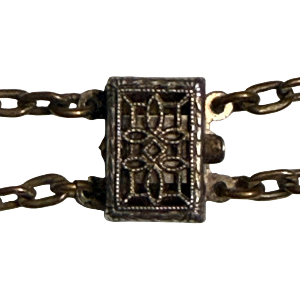 Decorative openwork sterling clasp on 1920s glass beaded choker
