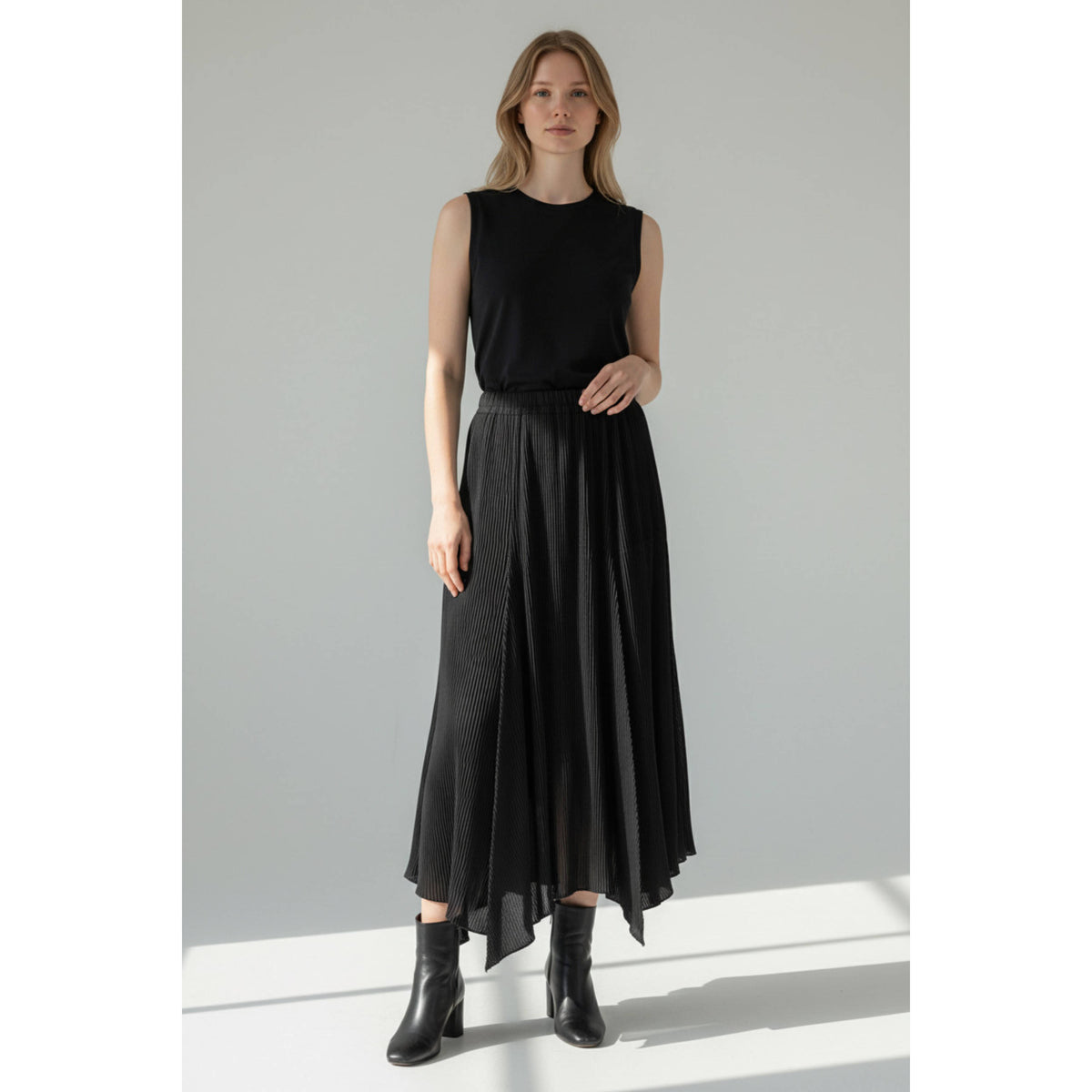 Vintage Issey Miyake black pleated skirt shown on AI generated model