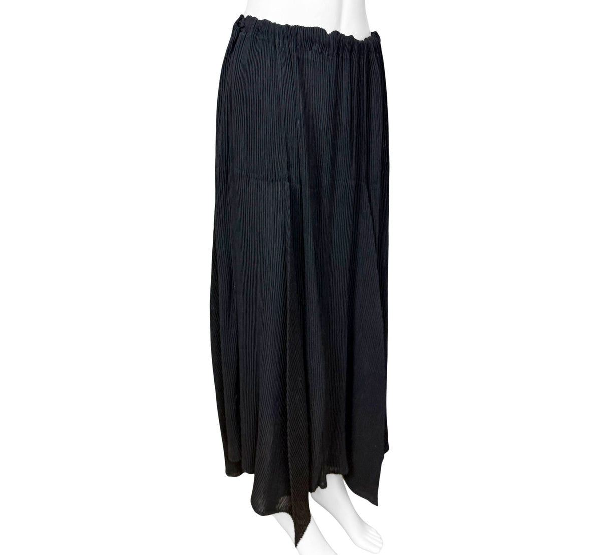 angle view of 1996 Issey Miyake black pleated skirt with asymmetric handkerchief hem