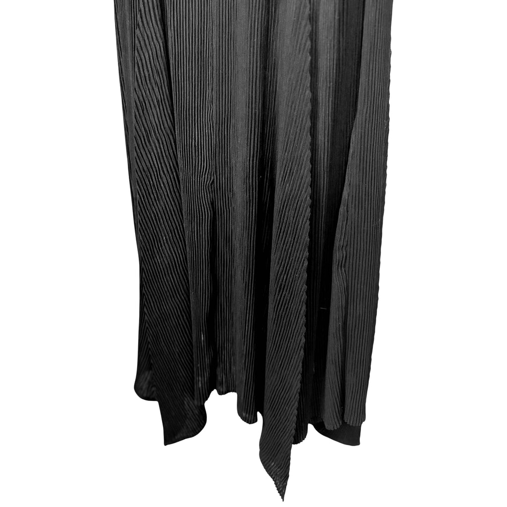 Issey Miyake black pleated skirt close-up showing fine vertical pleating