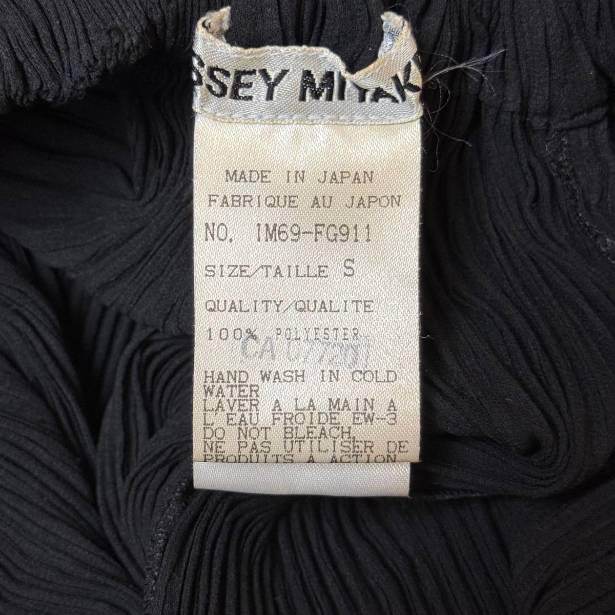 Issey Miyake Made in Japan label on vintage 1996 pleated skirt
