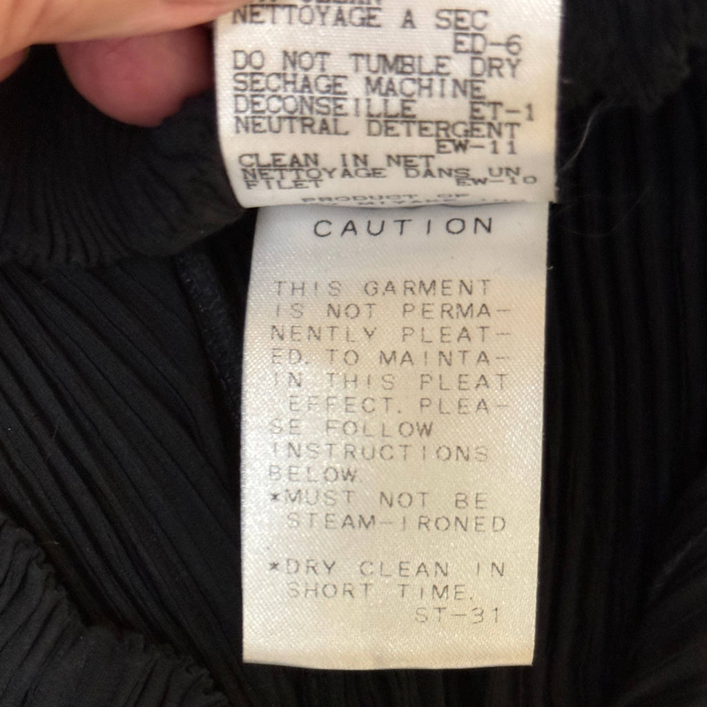 Issey Miyake pleated skirt original care and pleating caution label