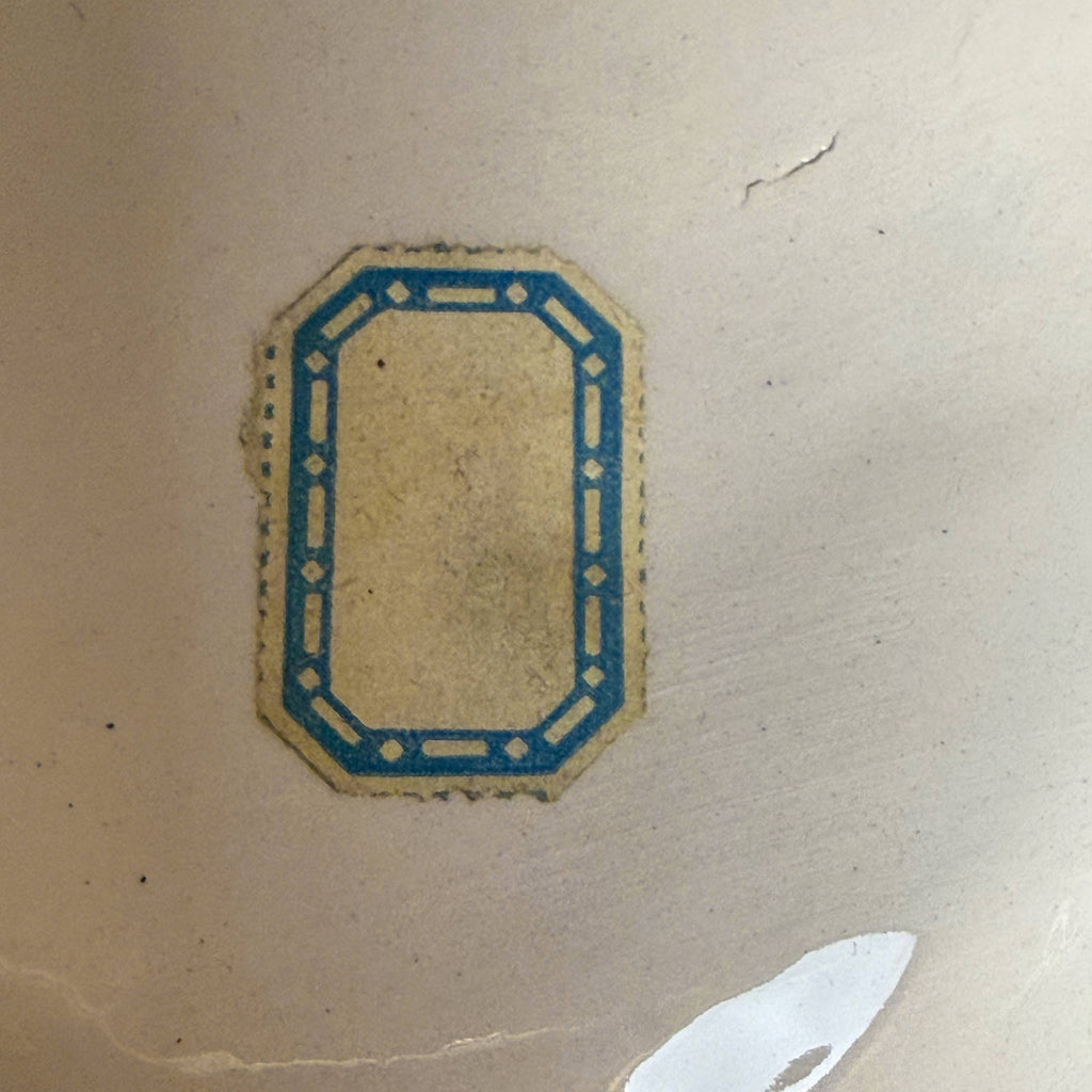 paper label on virgin mary bust