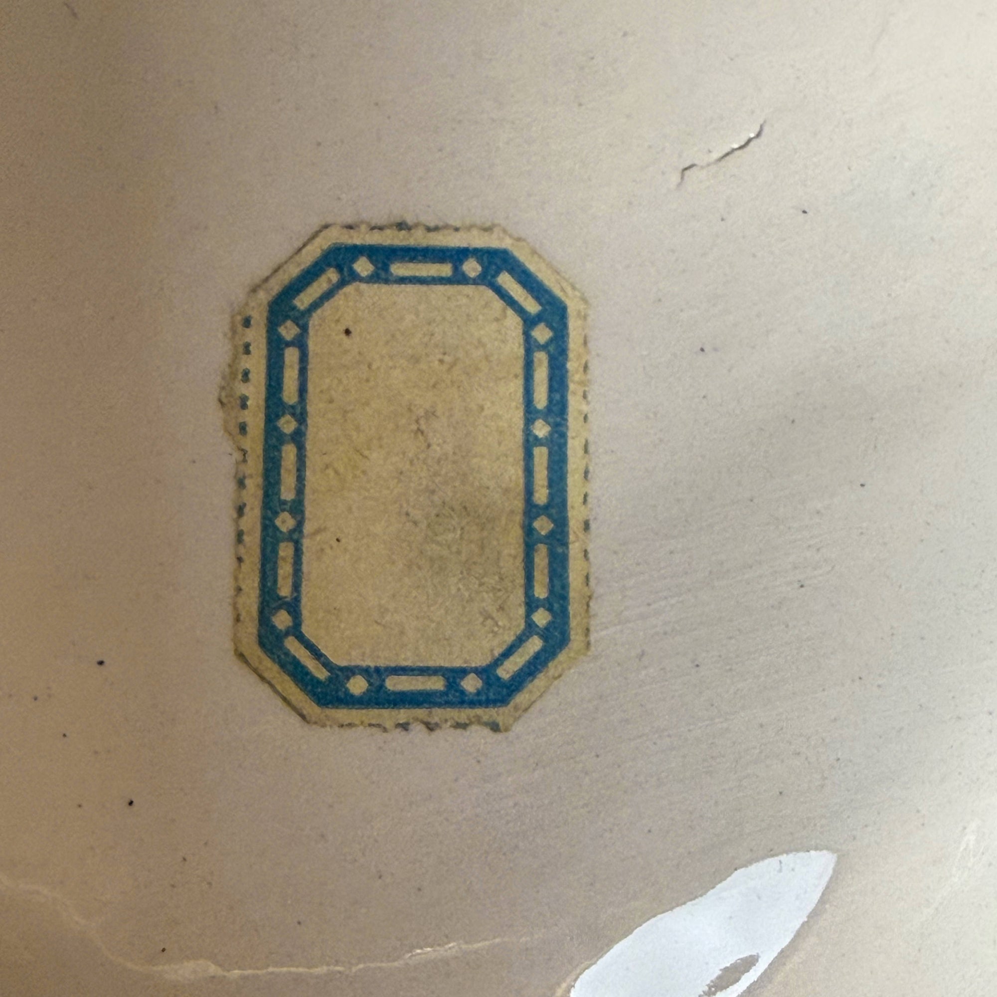 paper label on virgin mary bust
