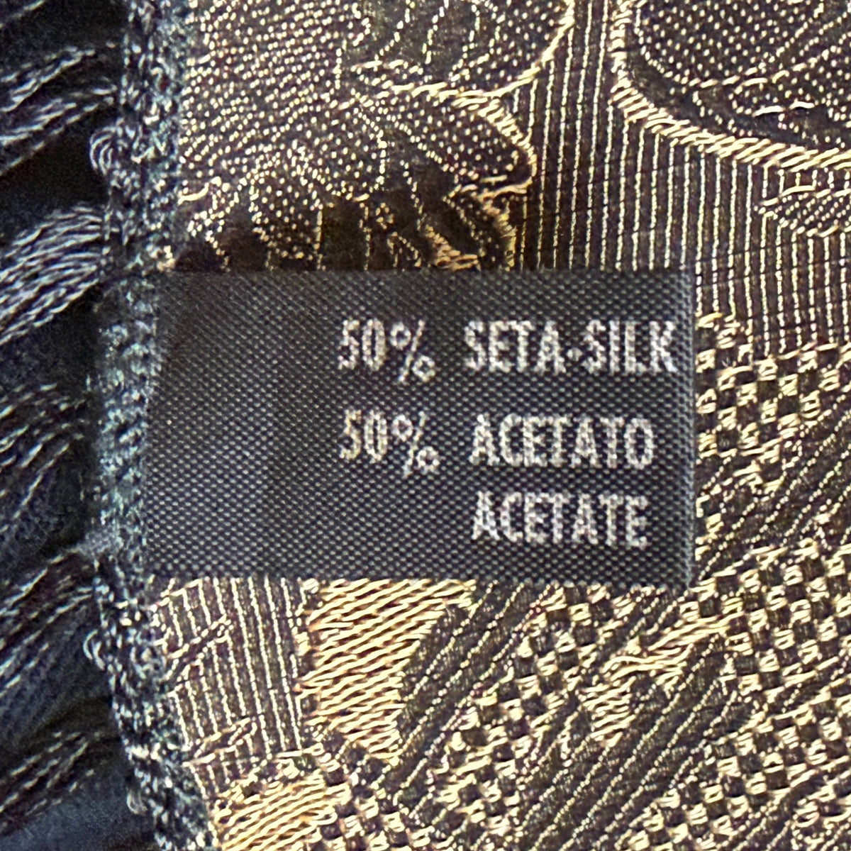 Original Italian textile label showing composition of 50 percent silk and 50 percent acetate