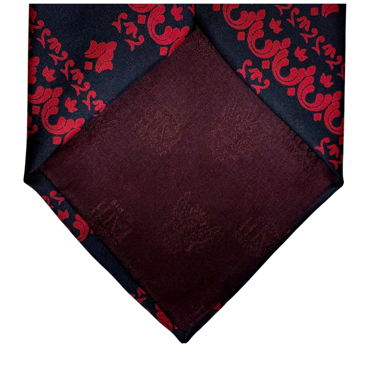 Burgundy silk lining of Jacques Fath necktie with woven Jacques Fath Paris lettering and coat of arms
