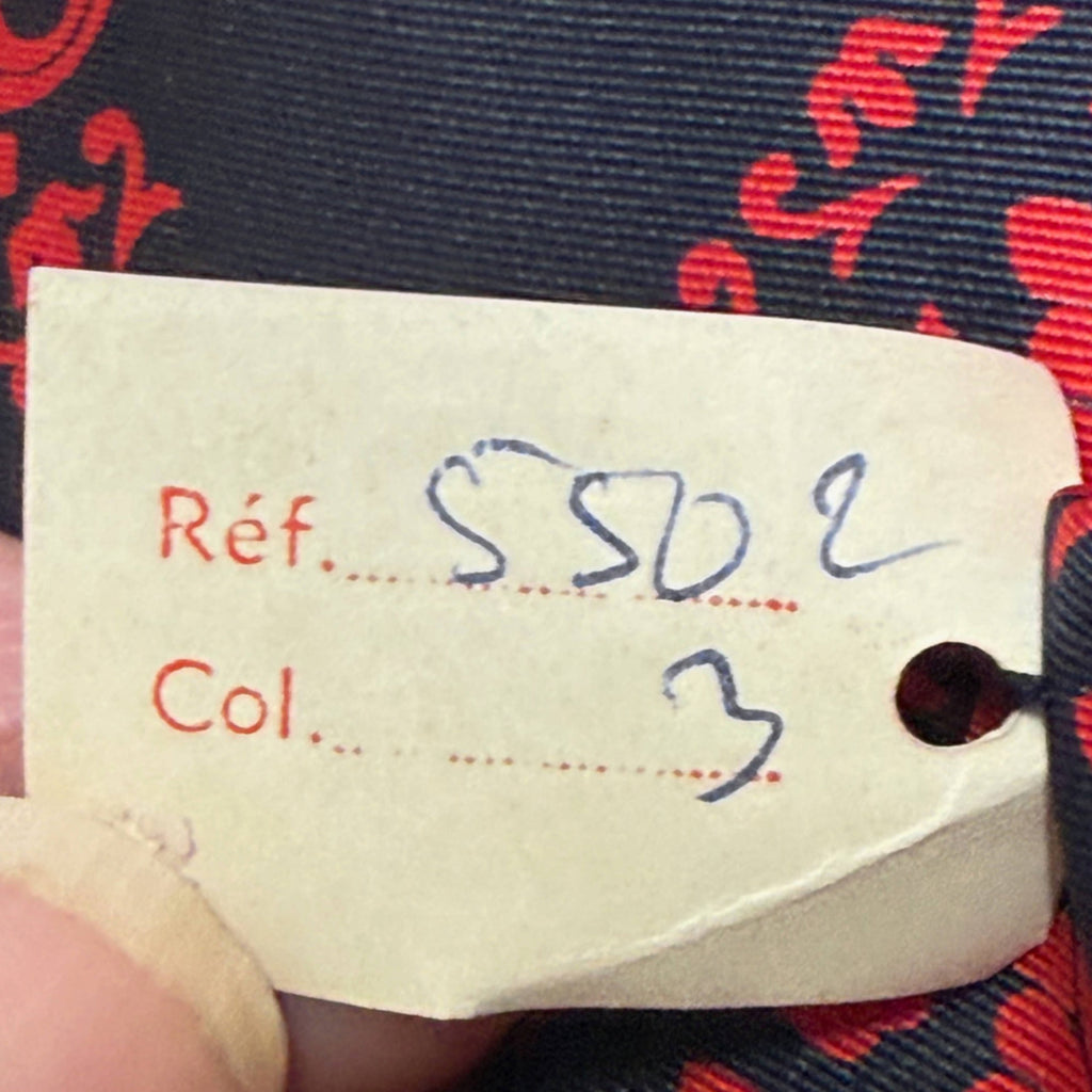 Original paper inventory tag on vintage Jacques Fath Paris silk necktie showing handwritten reference and colour numbers
