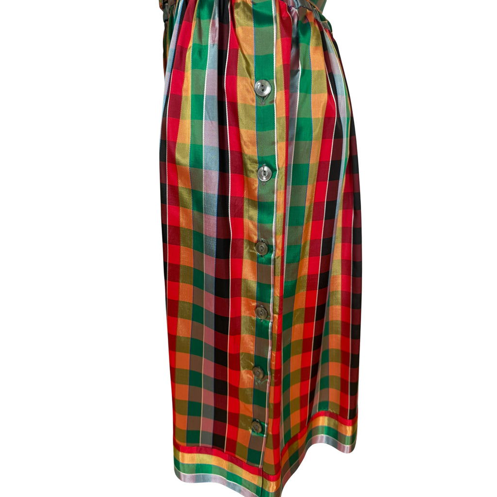 Detail of side button accents on 1970s plaid dress