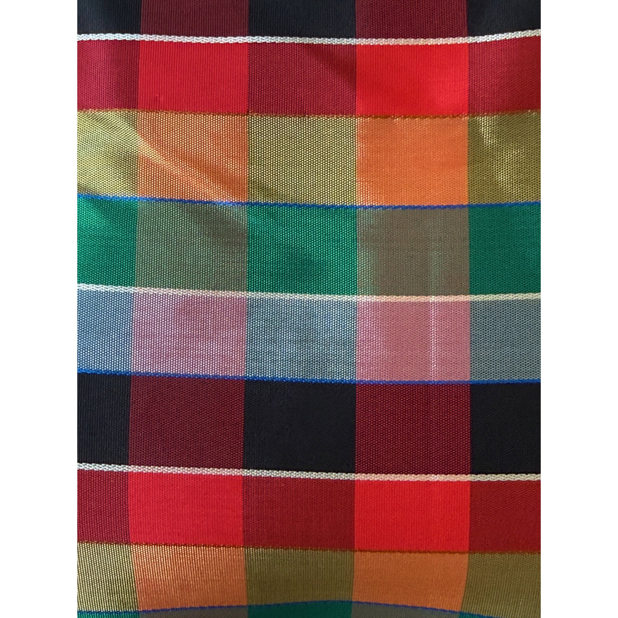 Close-up of glossy plaid acetate fabric in red green gold violet and maroon