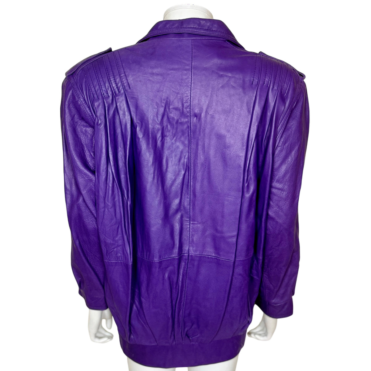 Back view of purple leather Jez Montréal jacket showing oversized shoulders, centre seam and gathered waistband