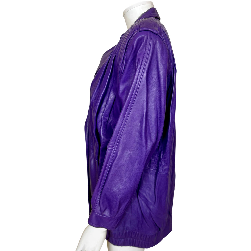 Side view of vintage purple leather jacket showing full sleeves, structured shoulders and elasticized hem.