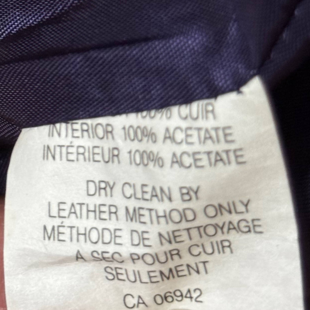 Composition label showing 100% leather exterior and 100% acetate lining