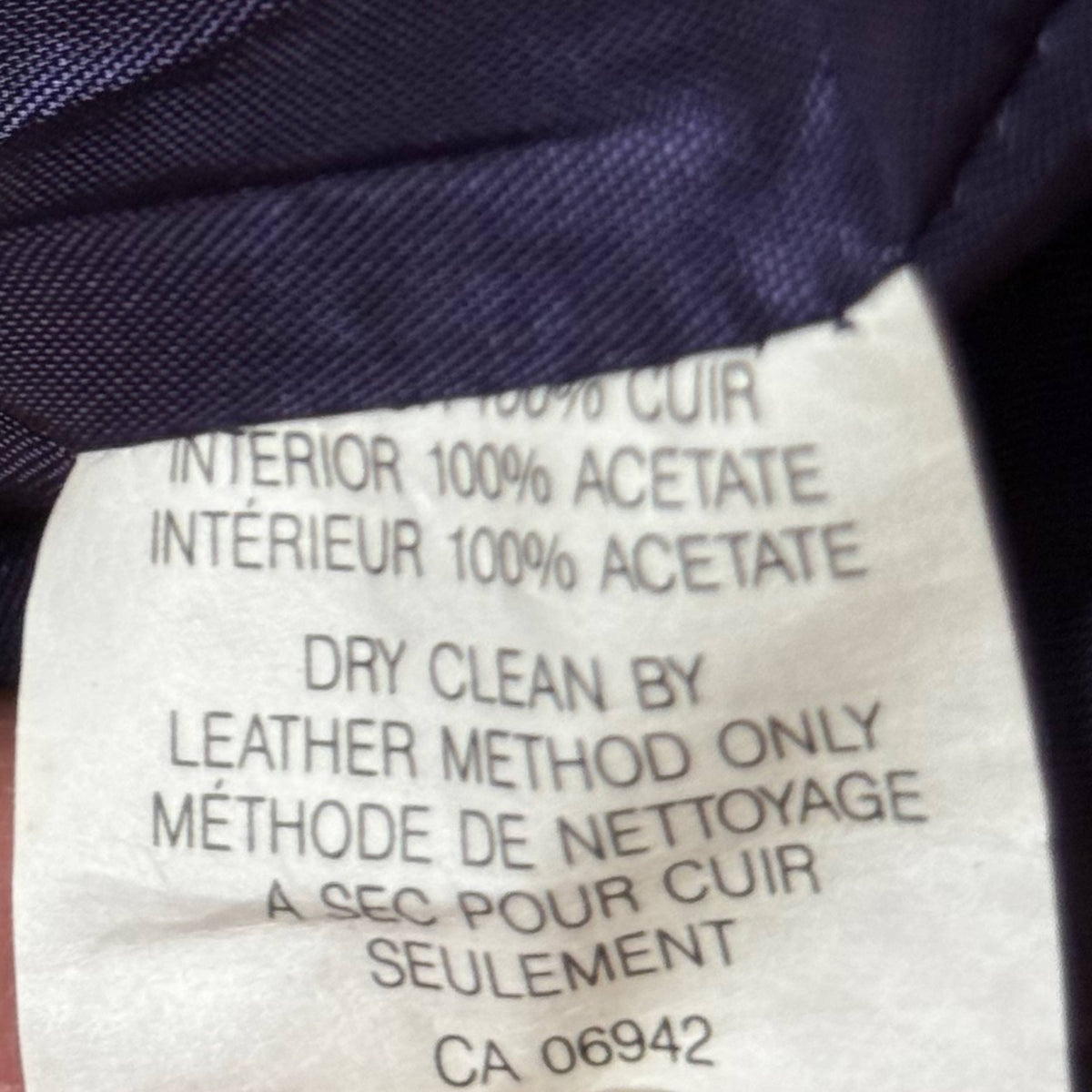 Composition label showing 100% leather exterior and 100% acetate lining