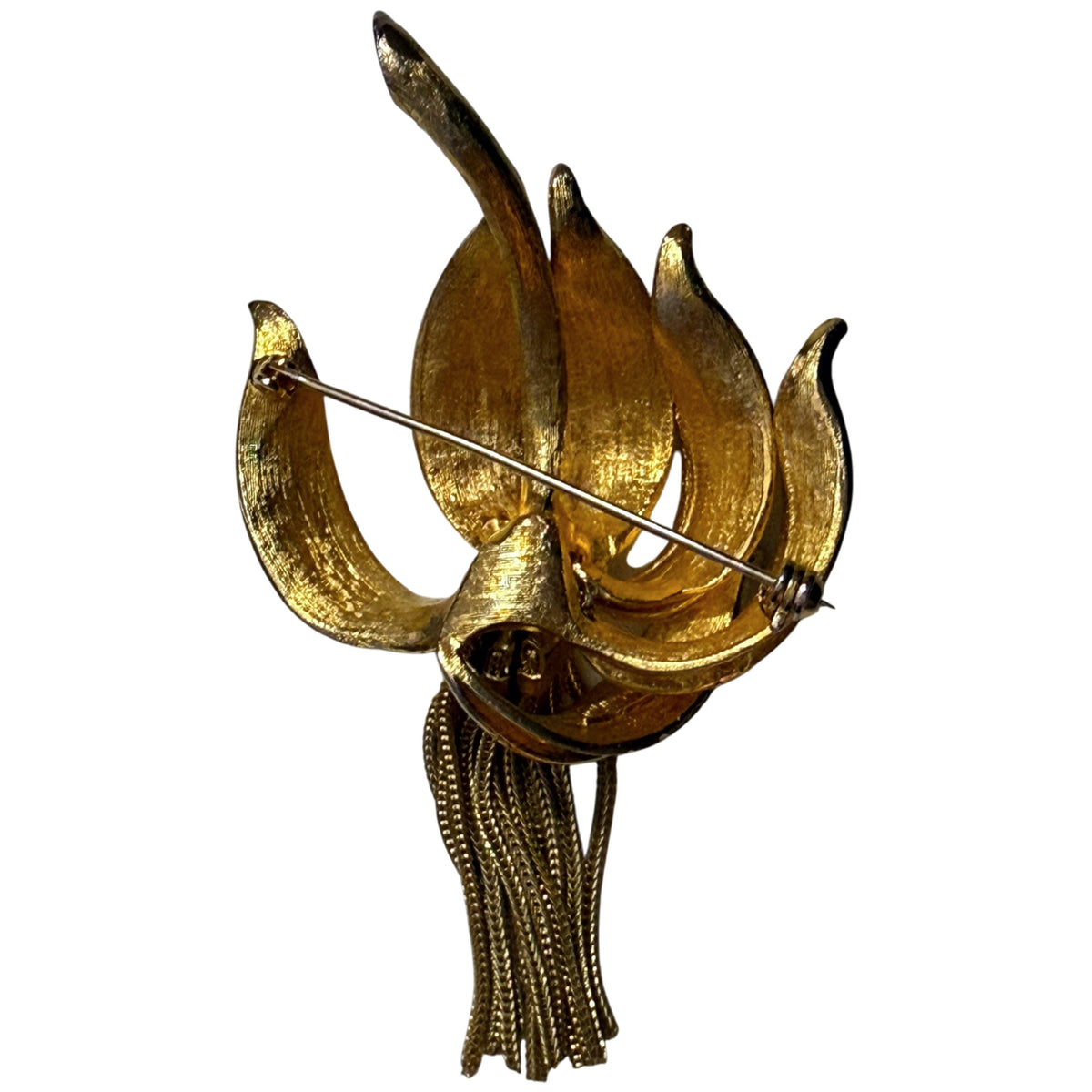 Reverse of vintage Kramer gold-tone lily brooch showing dimensional construction and pin clasp