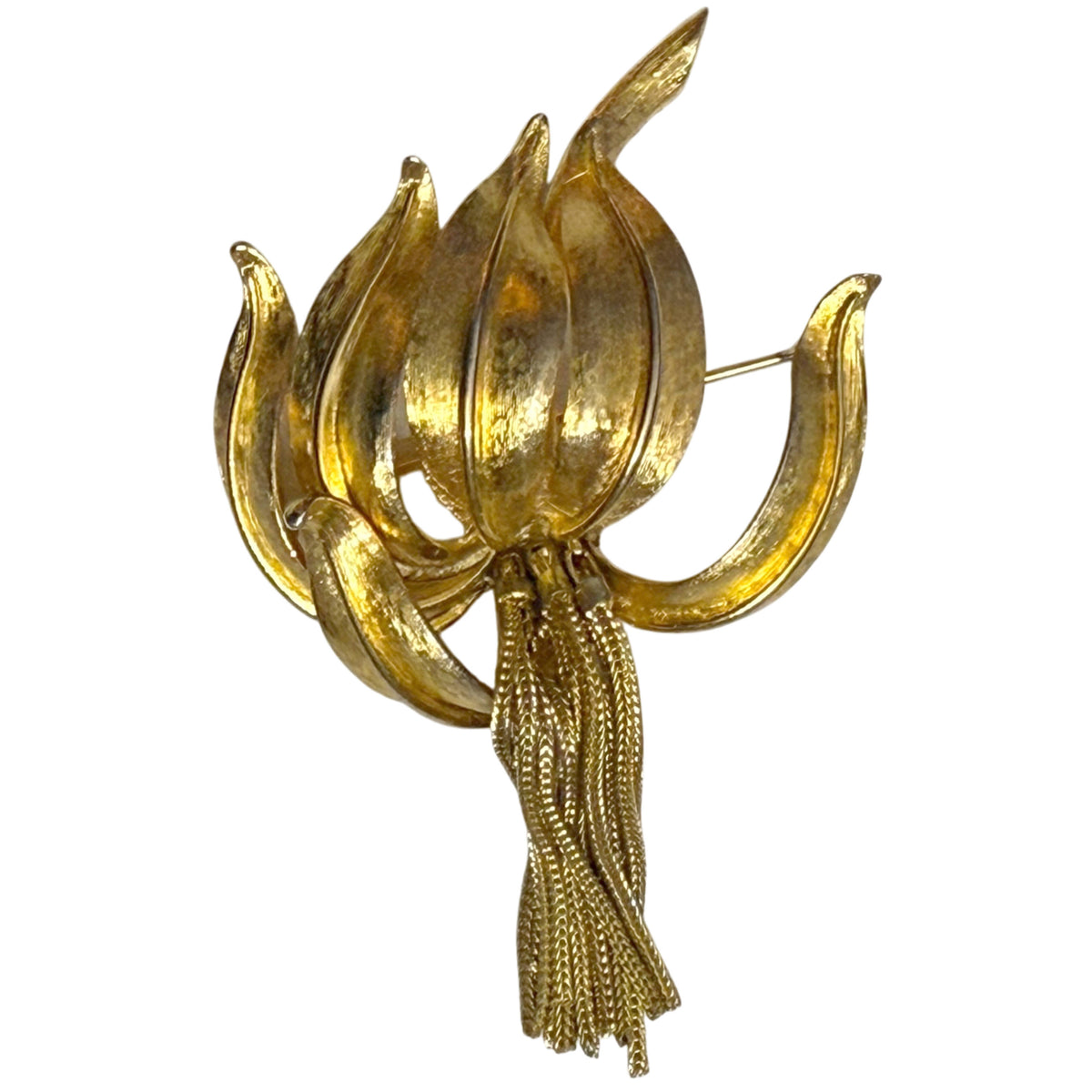 Vintage Kramer gold-tone lily brooch with sculptural petals and dangling chain tassels, front view