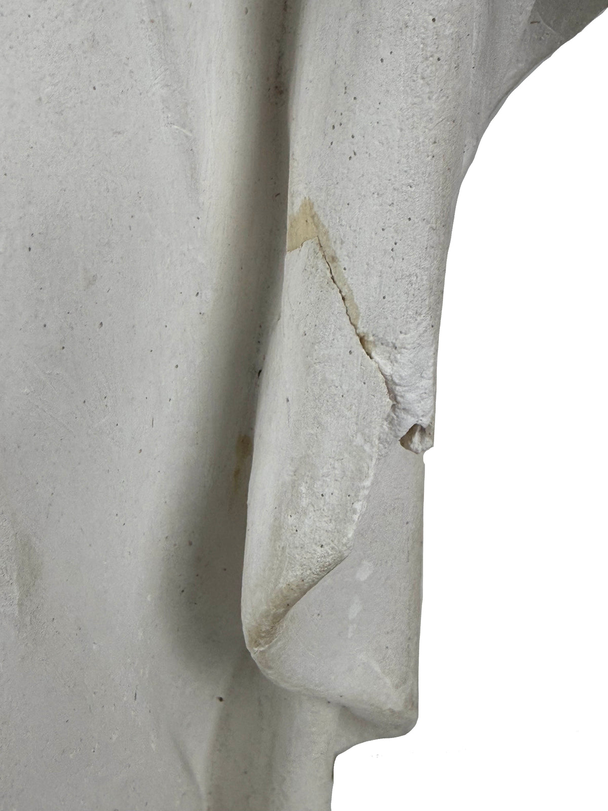 Old repair and plaster loss on Our Lady of Sorrows statue