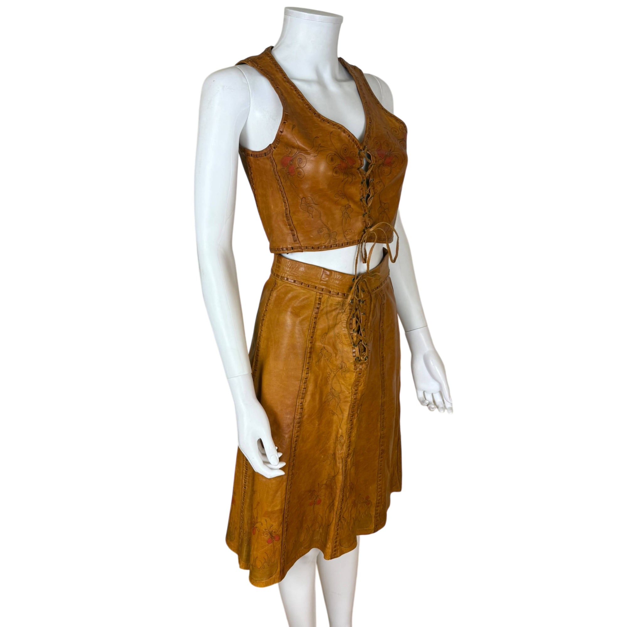 right side view of 1970s artisan leather top and skirt