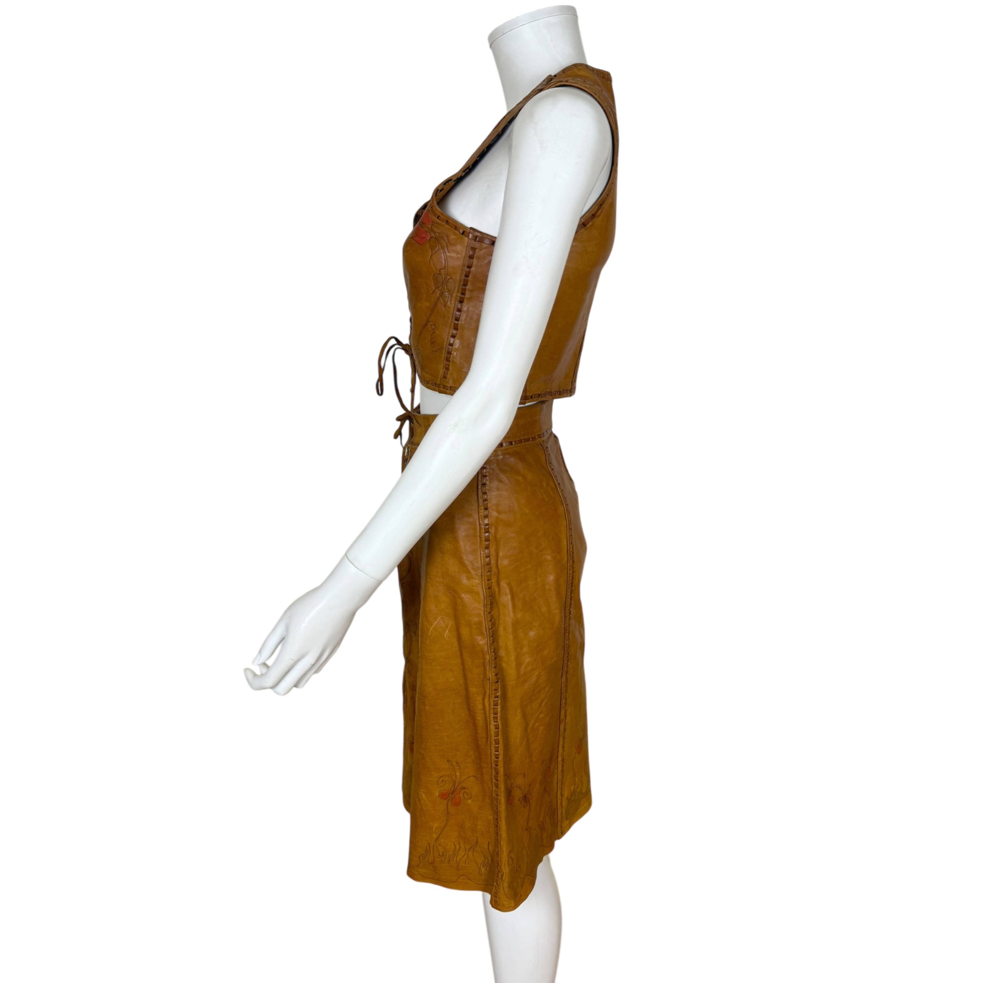 left side view of 1970s artisan leather top and skirt