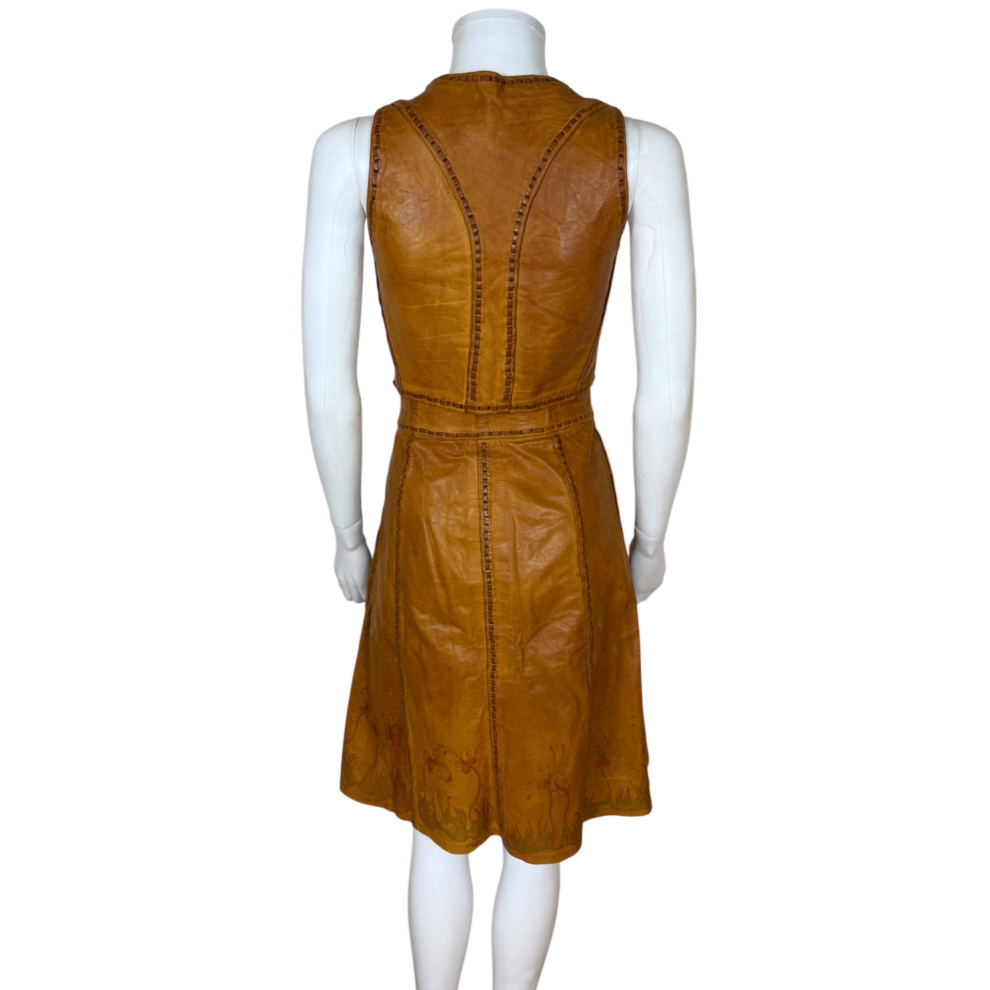 back view of 1970s artisan leather top and skirt