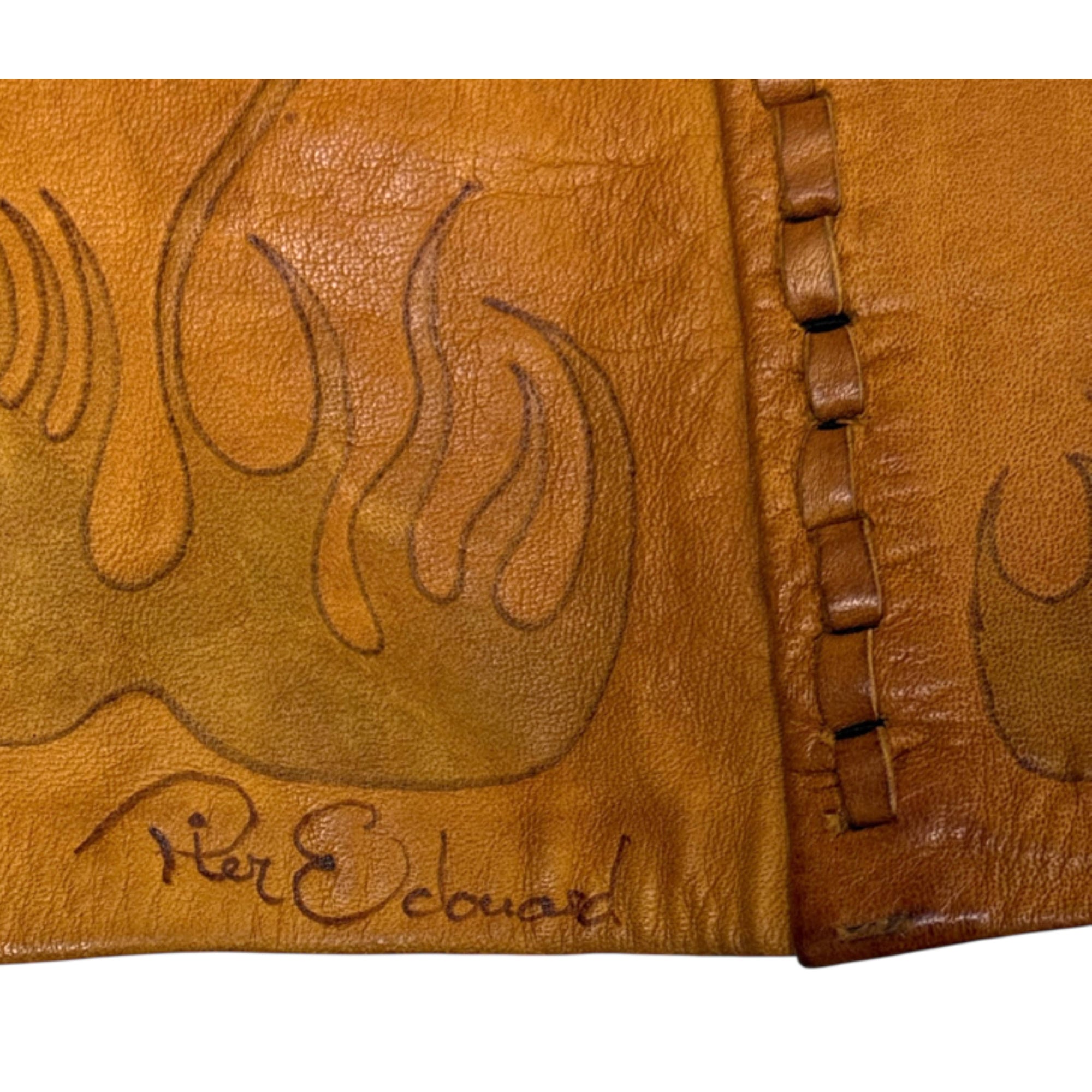signature on 1970s artisan leather skirt
