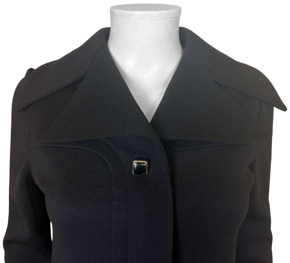 Pierre Cardin Space Age dress close-up showing oversized pointed collar, curved bodice seams and square decorative button