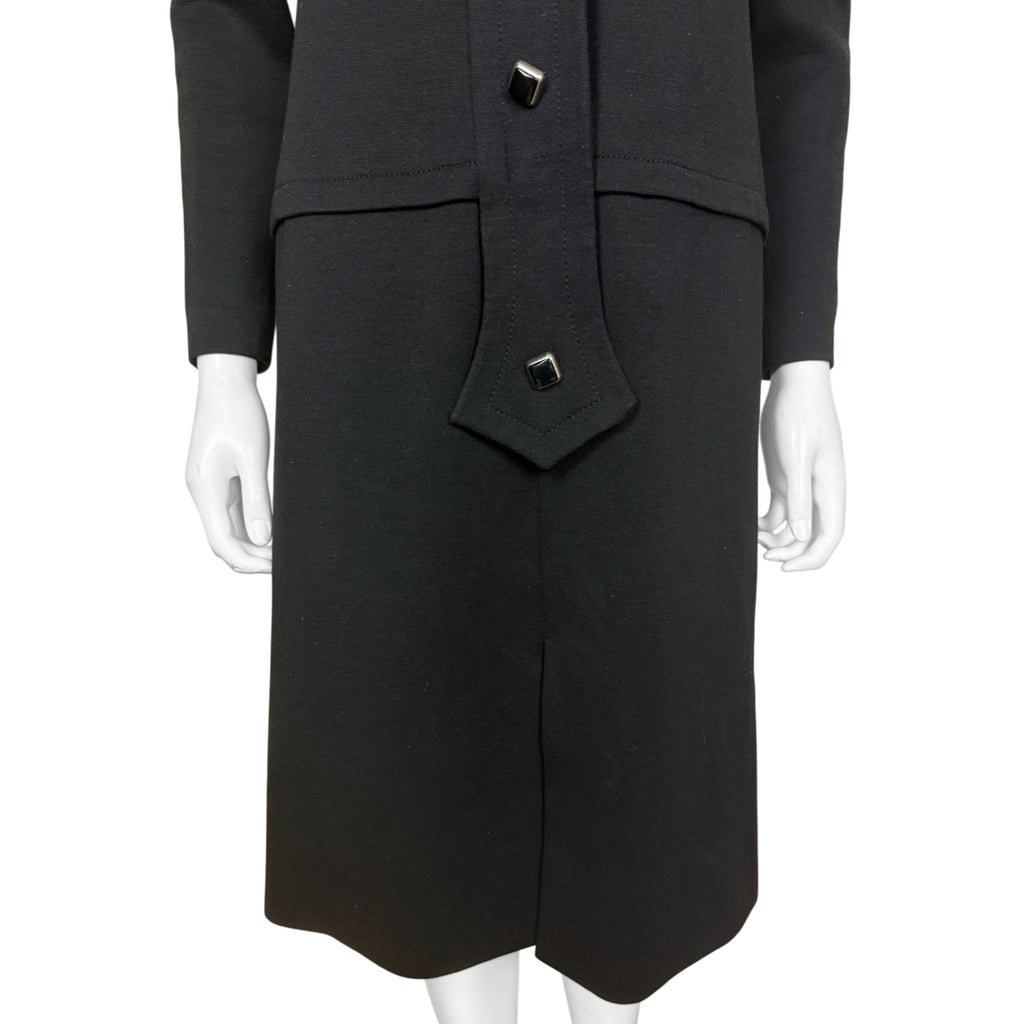 Vintage Pierre Cardin black wool jersey dress showing elongated pointed front placket and geometric buttons