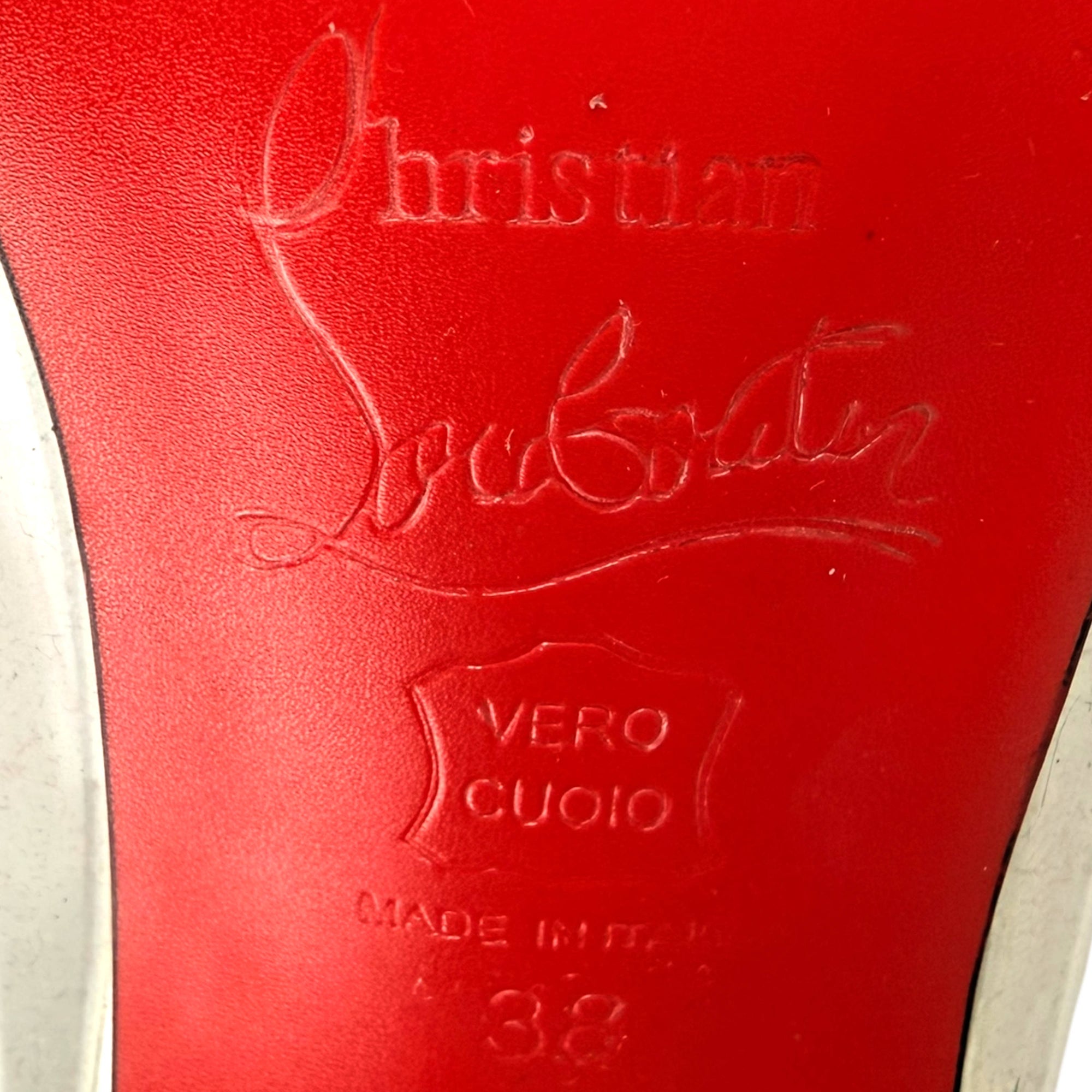 Louboutin stamping on red soles