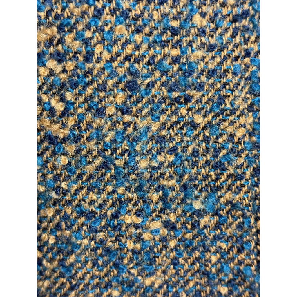 Vintage wool bouclé fabric close-up in teal blue navy and camel