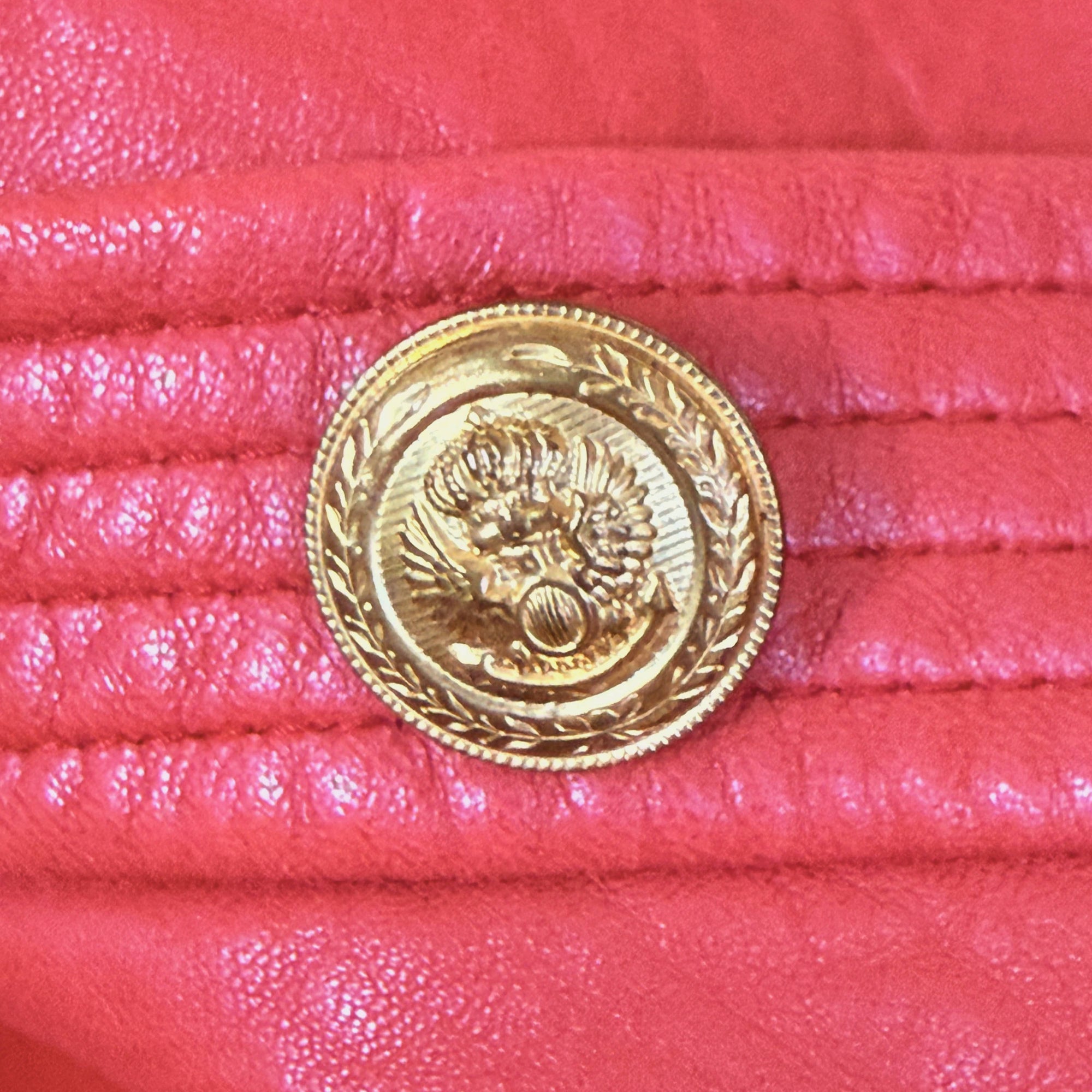 close up of button on vintage 1970s Margaret Godfrey red leather jacket by Bagatelle 