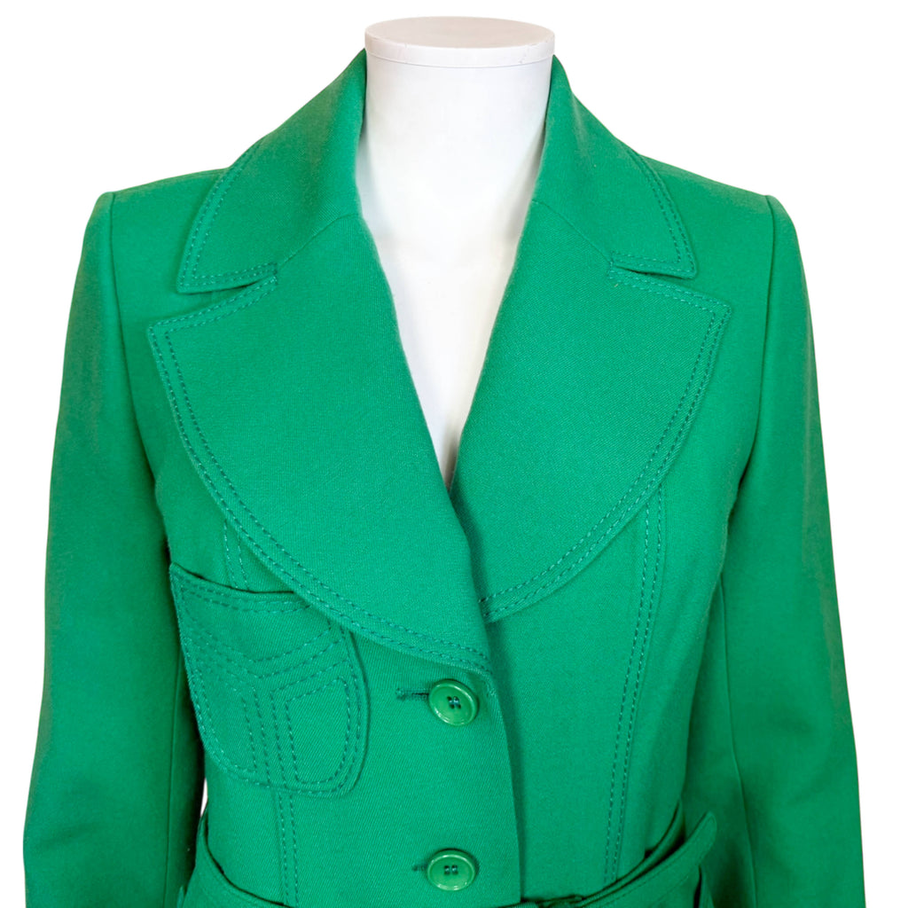 Close-up view of vintage 1970s green wool spring coat