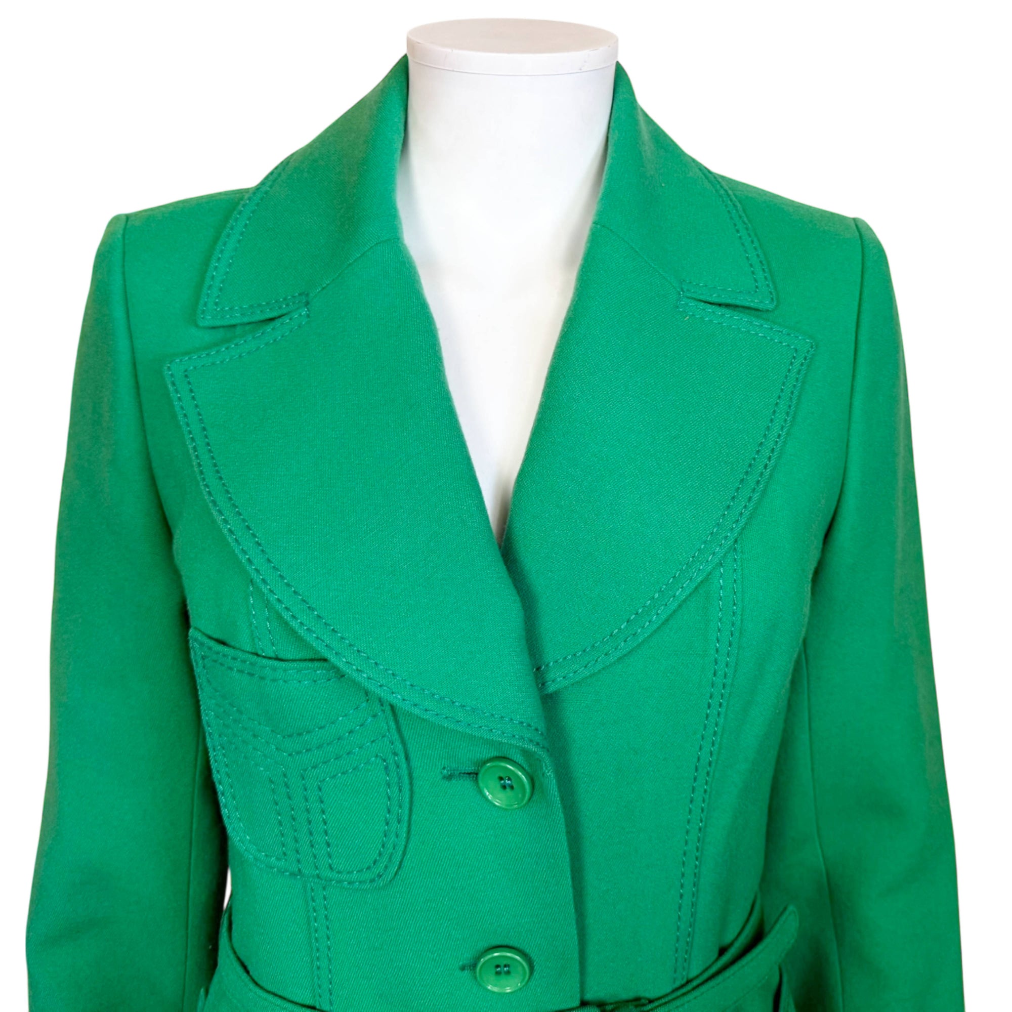 Close-up view of vintage 1970s green wool spring coat