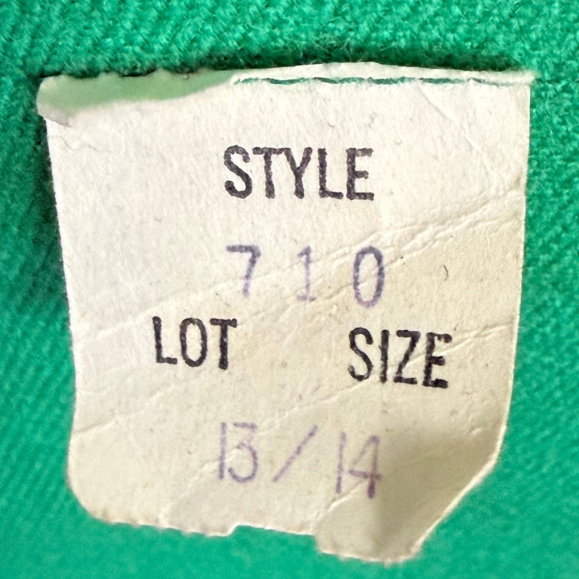 Size tag on vintage 1970s green wool spring coat